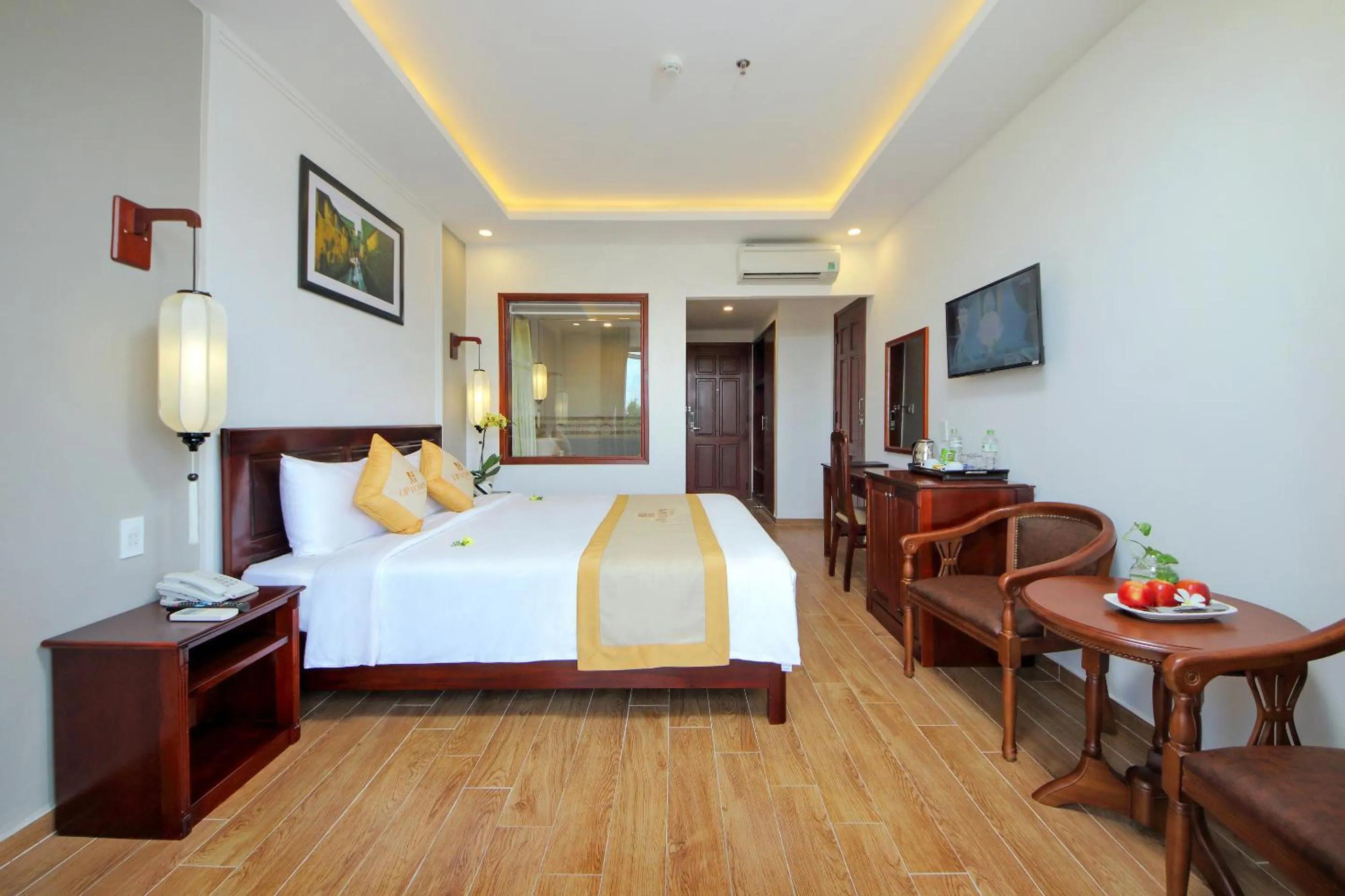 Photo of the whole room, Bed in Uptown Hoi An Hotel & Spa