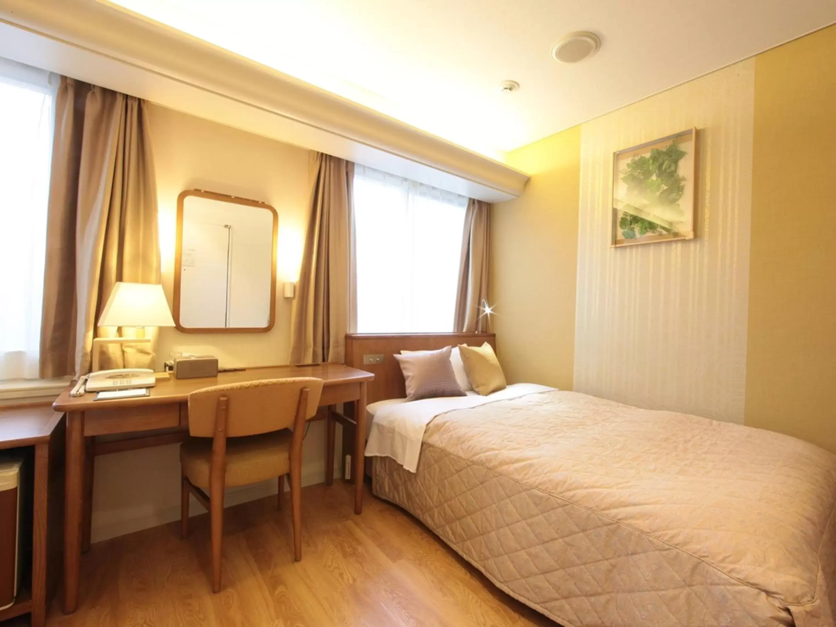 Bed in Hotel Monarque Tottori