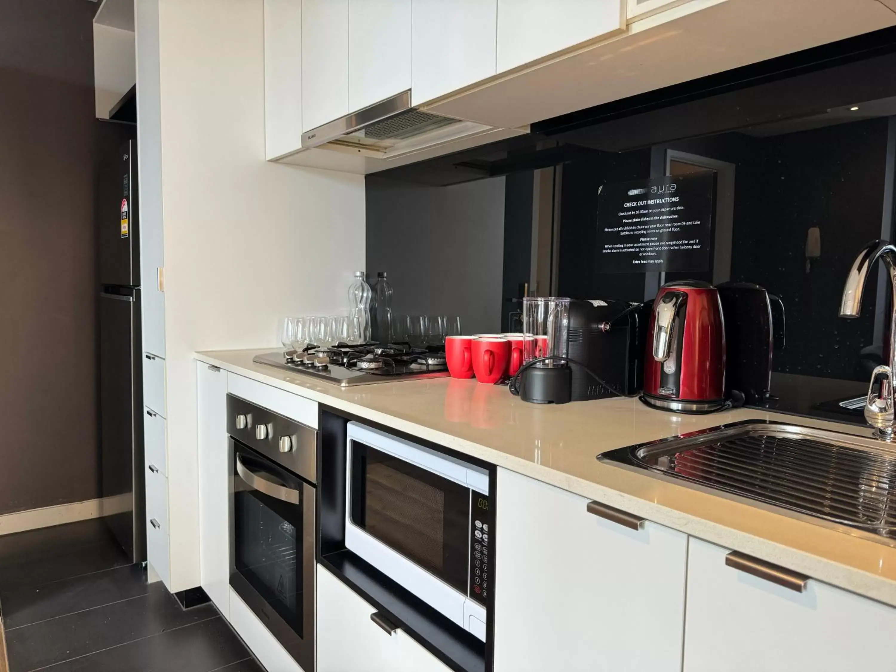 Kitchen/Kitchenette in Aura on Flinders Serviced Apartments