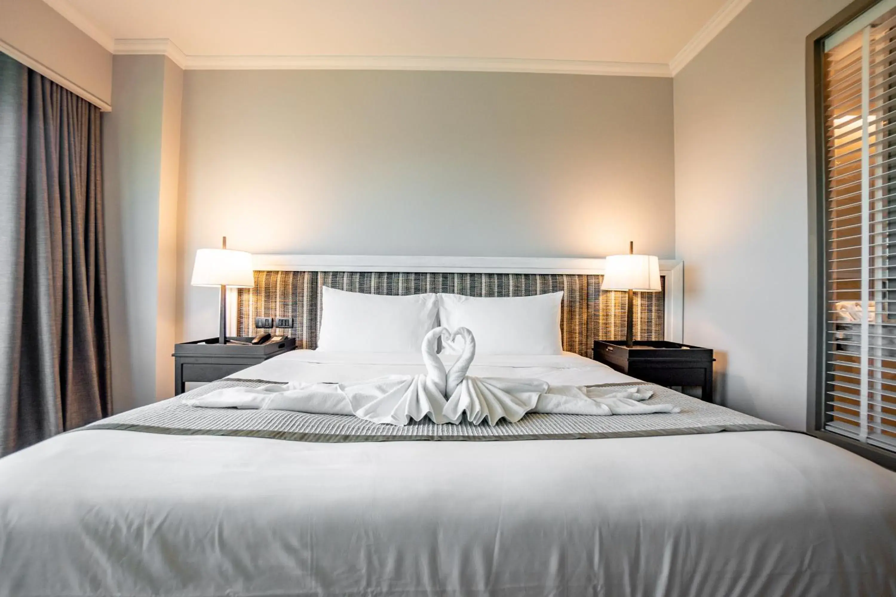 Bed in The Grand Riverside Hotel Bed in The Grand Riverside Hotel