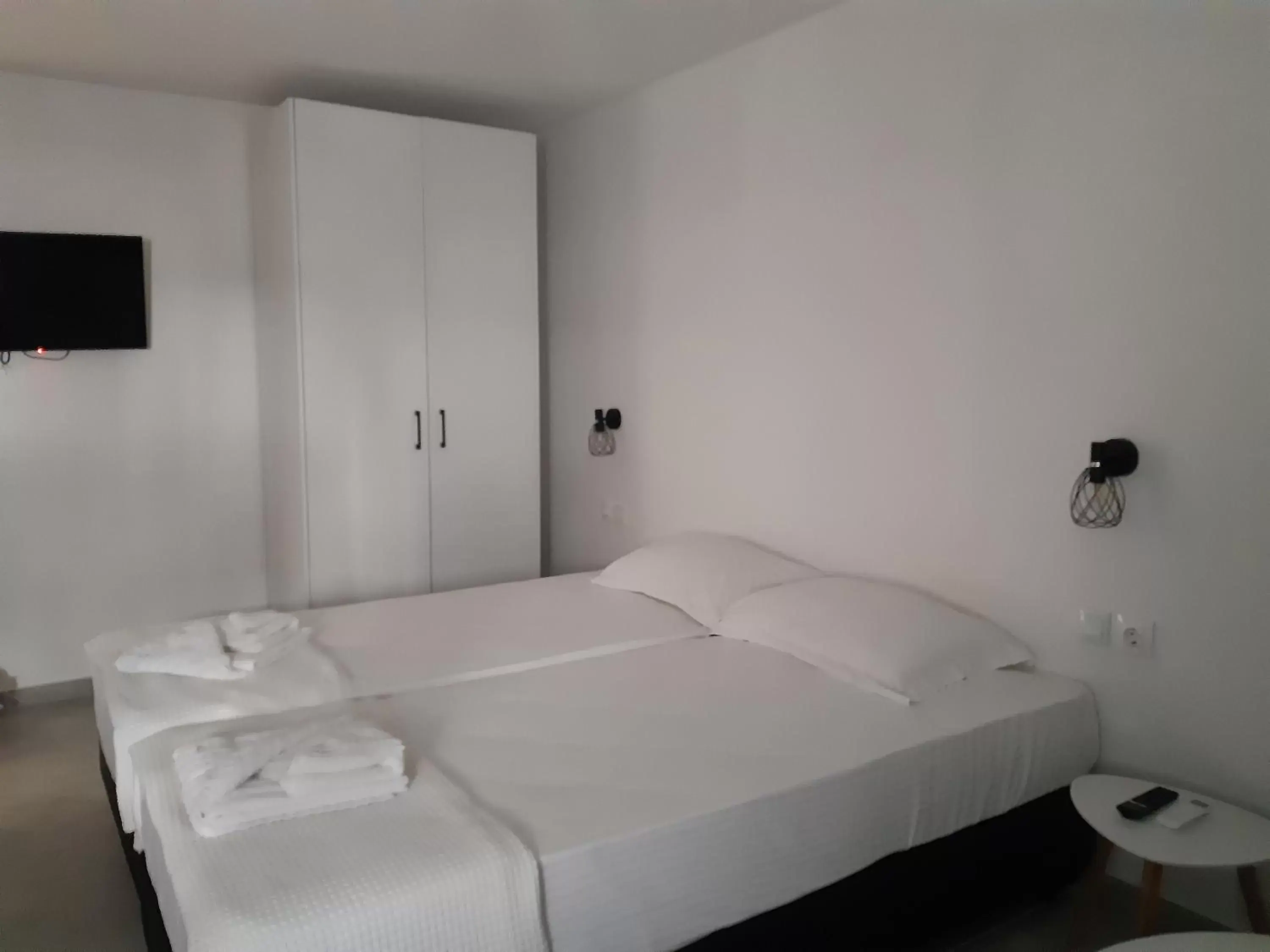 Bed in Evita's Luxury Apartments