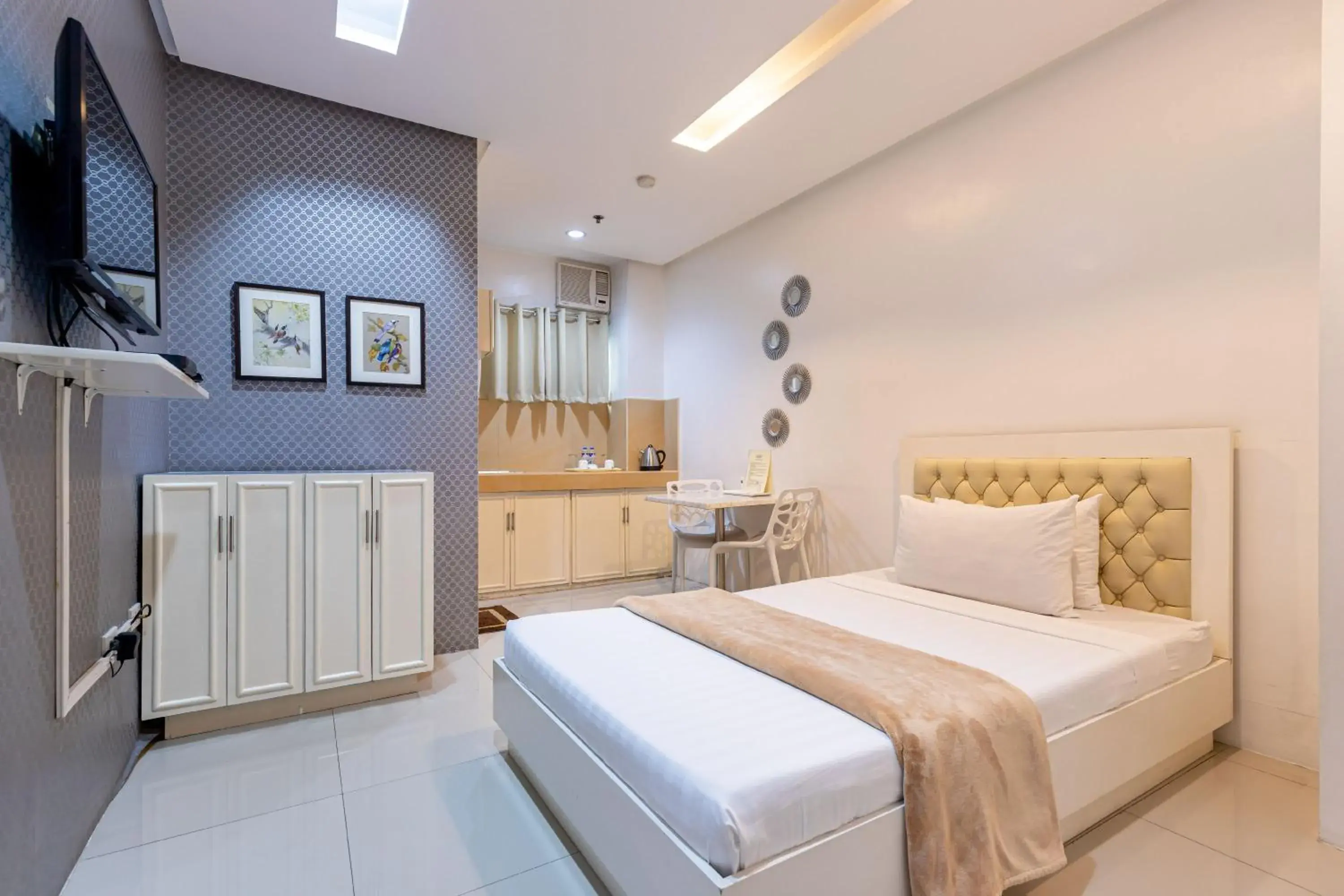 Bed in Baymont Suites and Residences