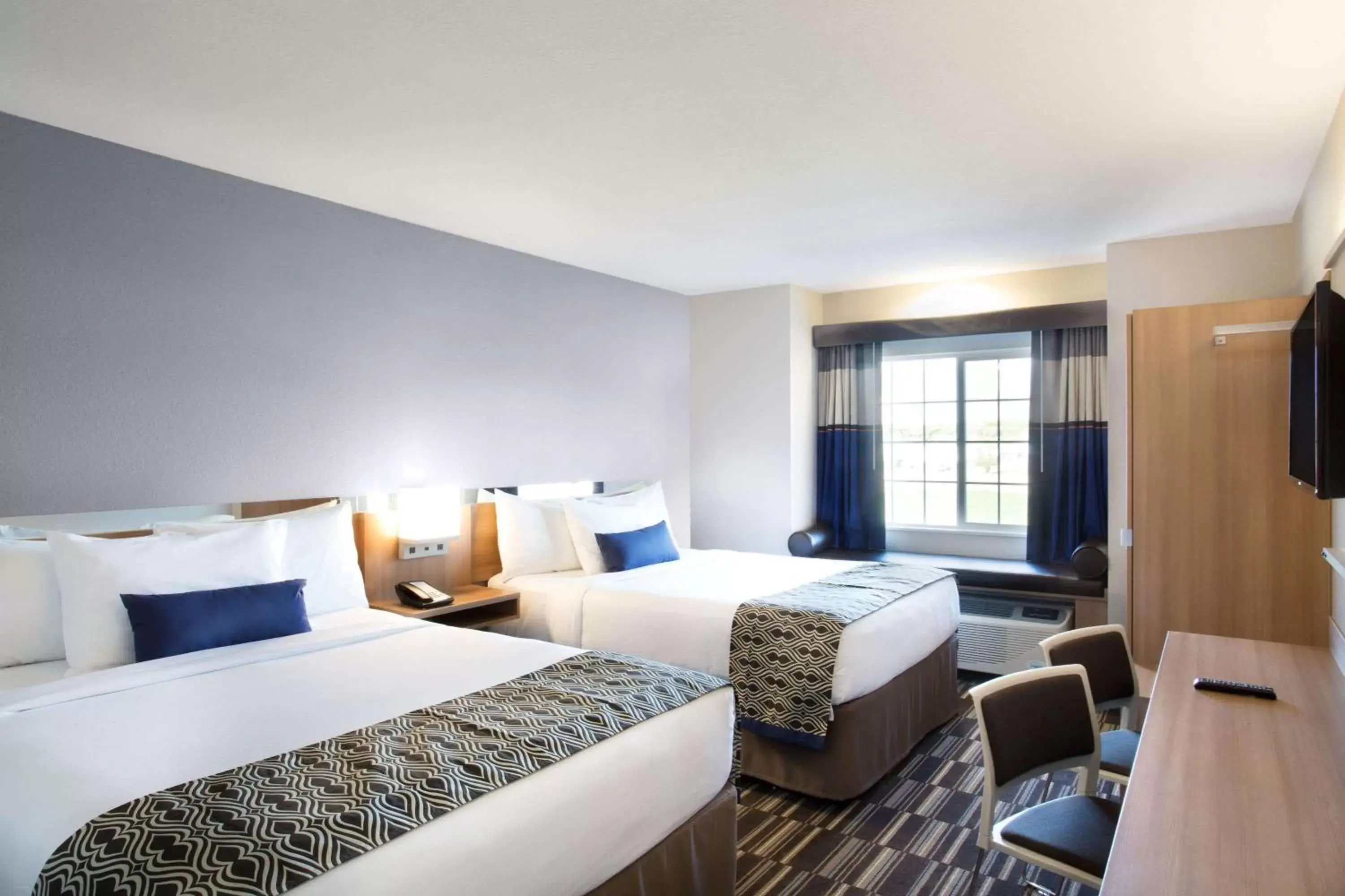 Bedroom in Microtel Inn & Suites by Wyndham Vernal/Naples