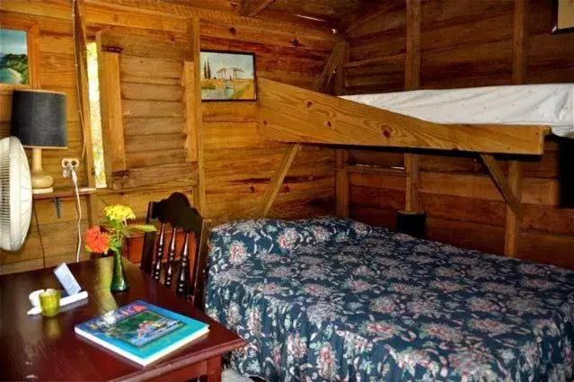 Bed in Secret Cabins at Firefly Beach Cottage