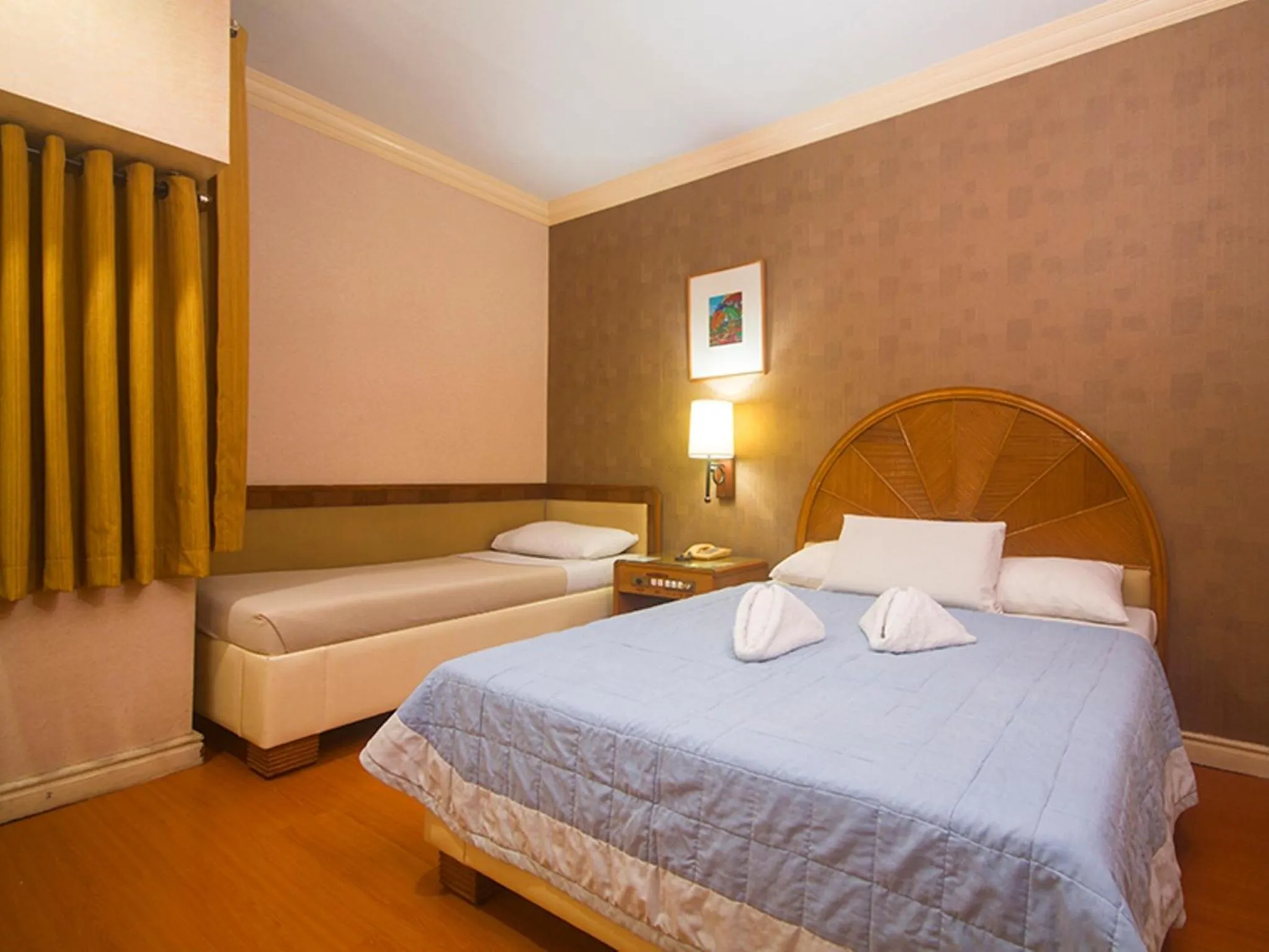Bed in Grand City Hotel Inc.