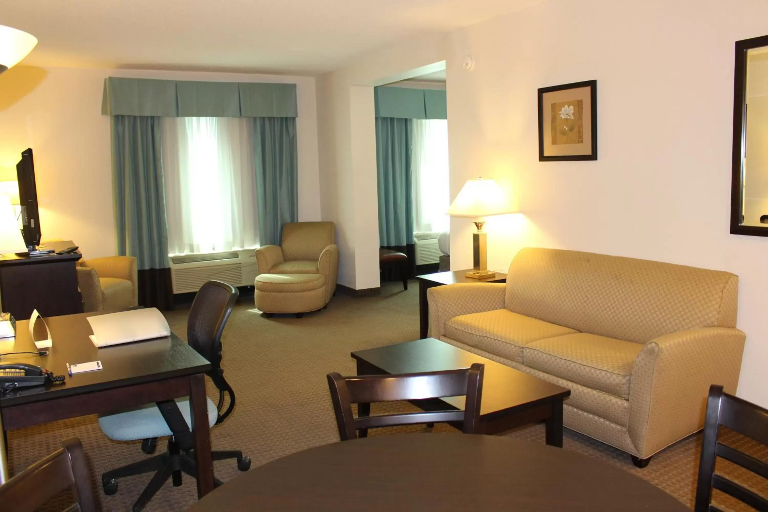 Photo of the whole room, Seating Area in Holiday Inn Express & Suites Mobile West I-10, an IHG Hotel