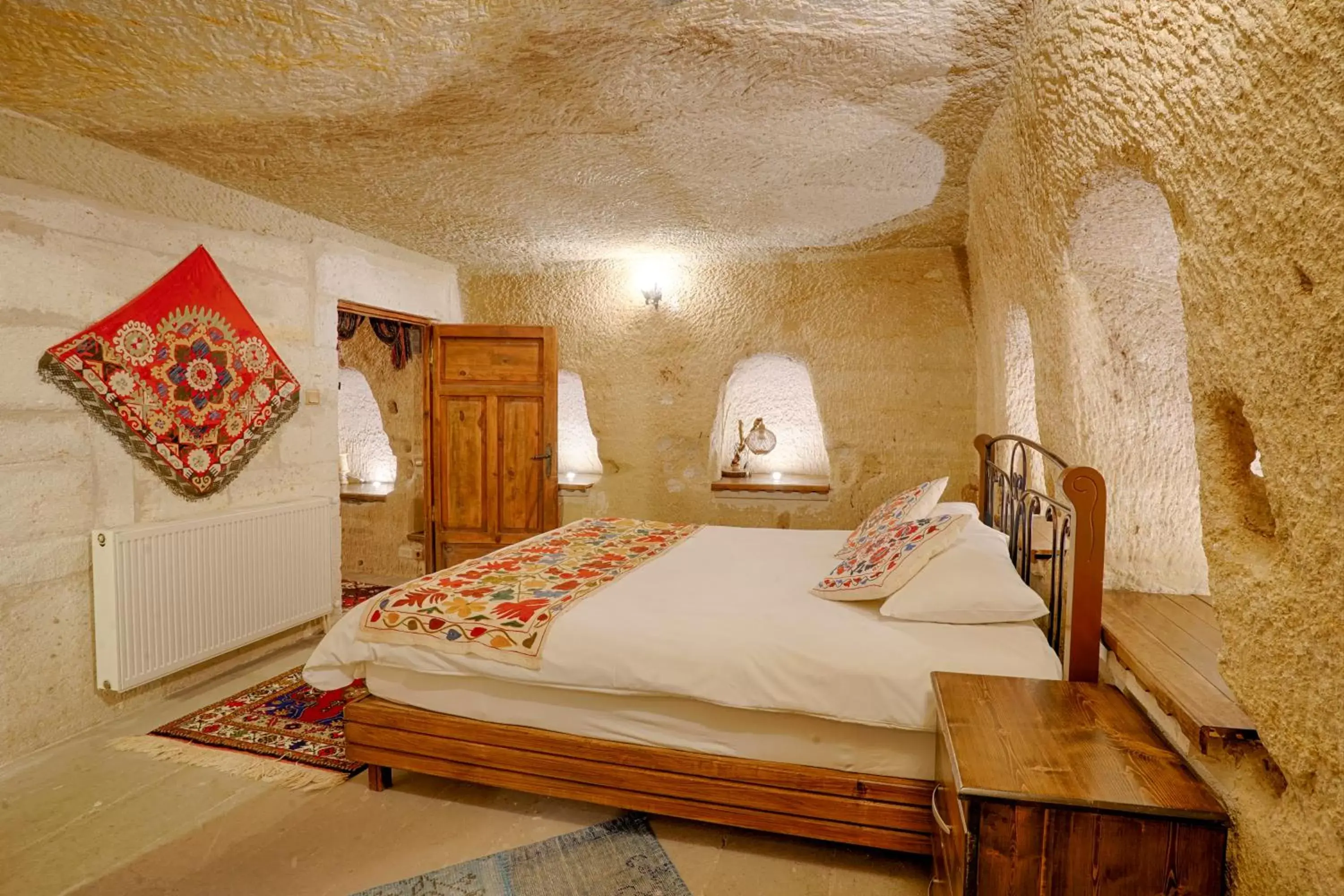 Bed in Tulip Cave Suites