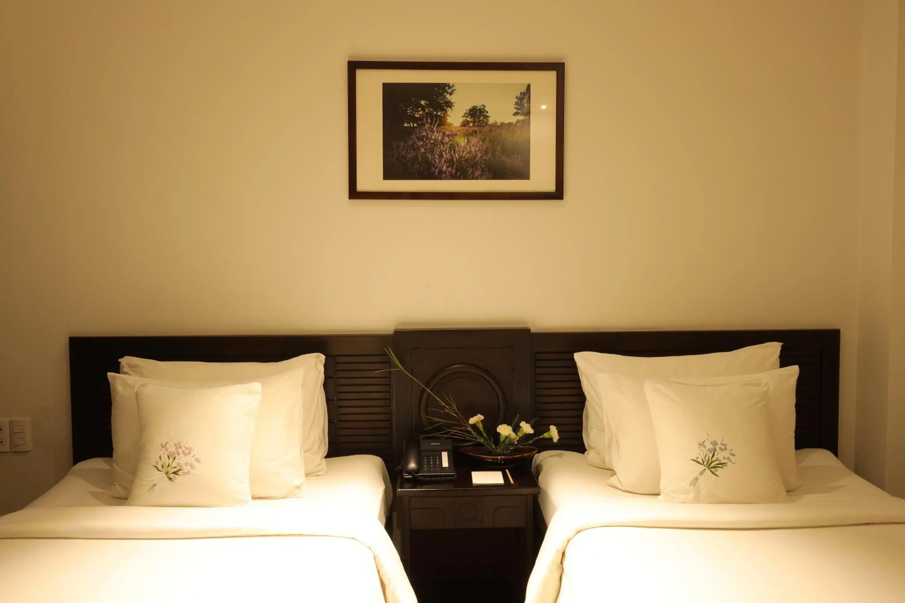 Bed in Cochin Zen Hotel