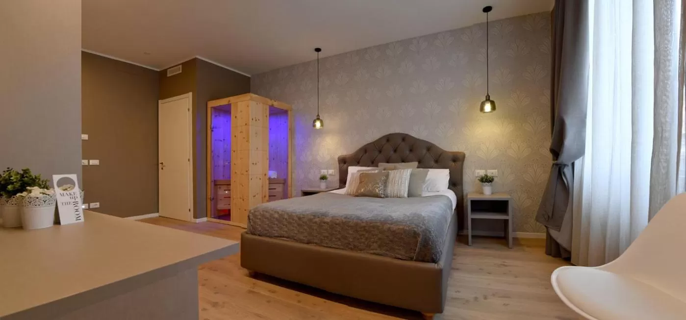 Bed in Lainez Rooms & Suites