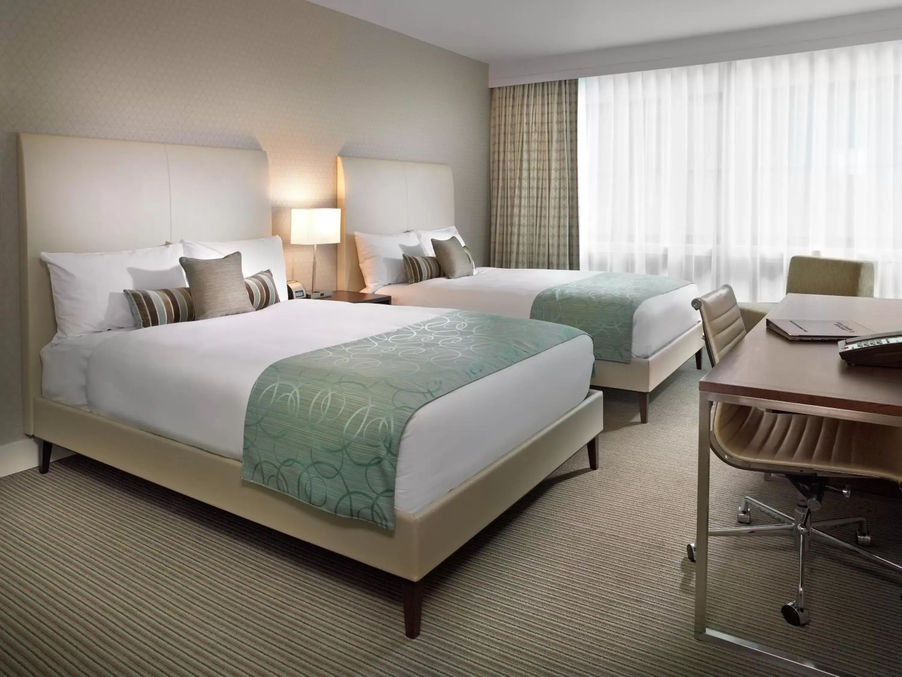 Bed in Coast Coal Harbour Vancouver Hotel by APA