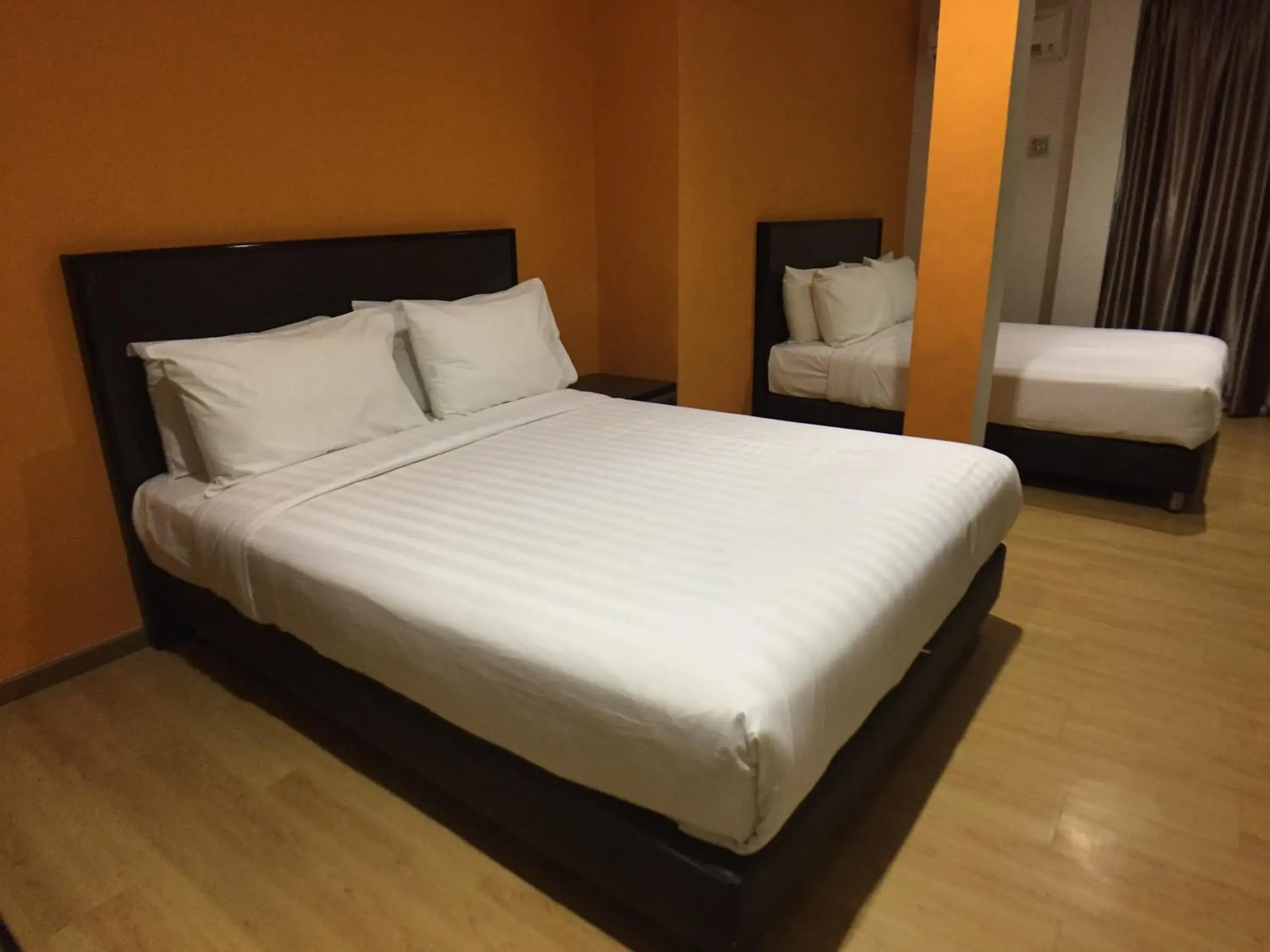 Bed in Padungan Hotel