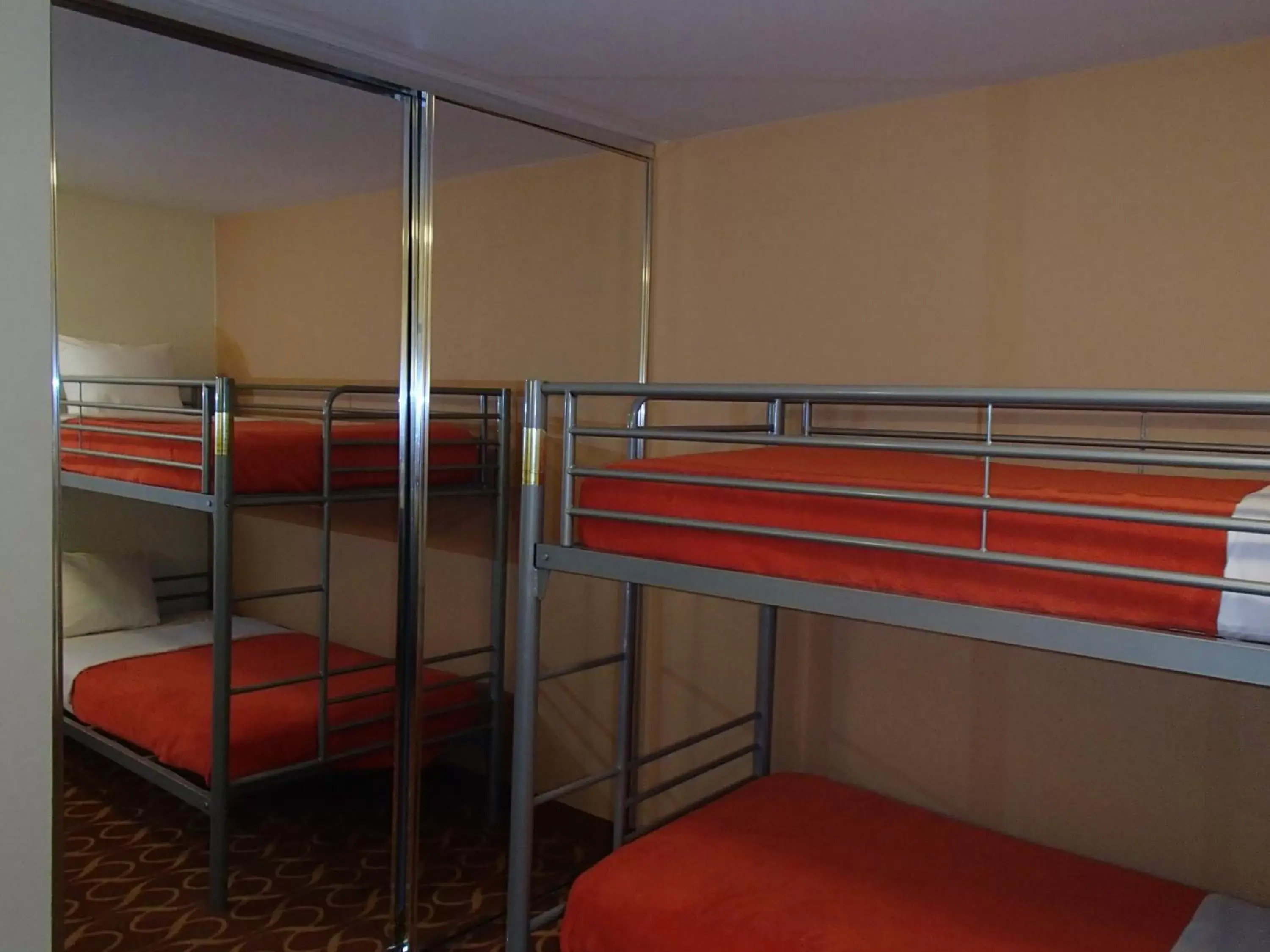 Bed, Bunk Bed in Lux Hotel & Spa, Trademark Collection by Wyndham