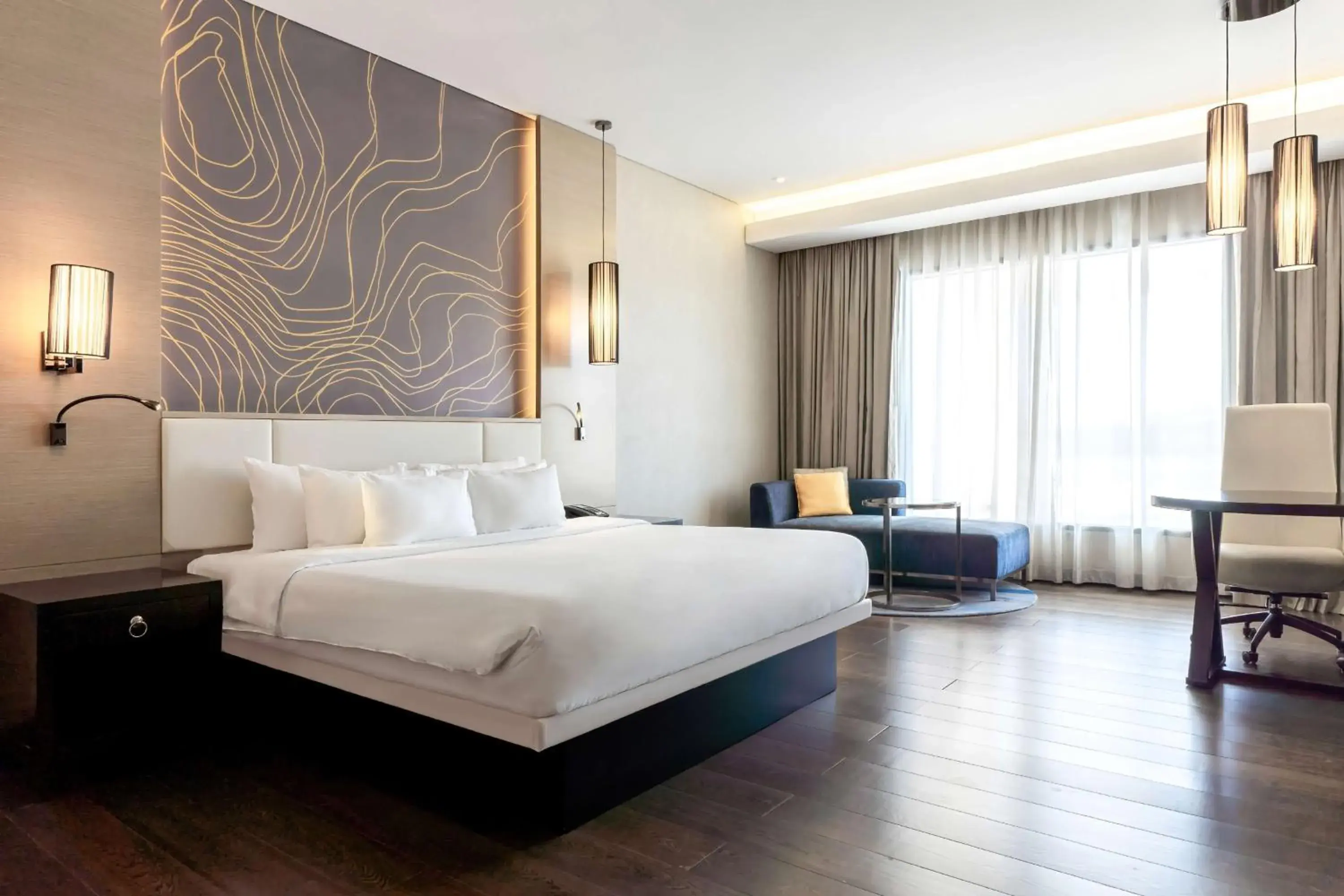 Bed in Radisson Collection Muscat, Hormuz Grand