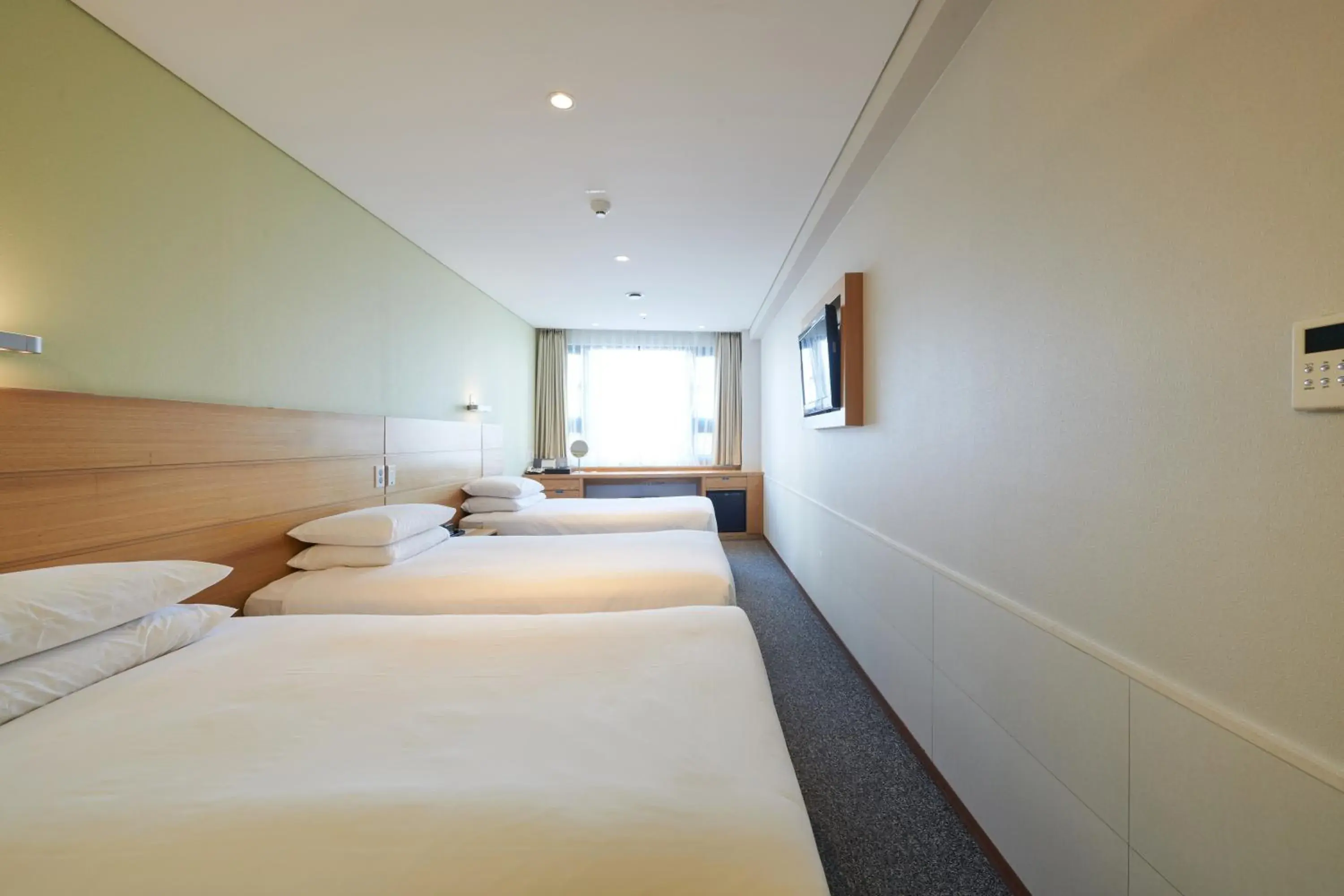 Bed in Nine Tree Hotel Myeongdong