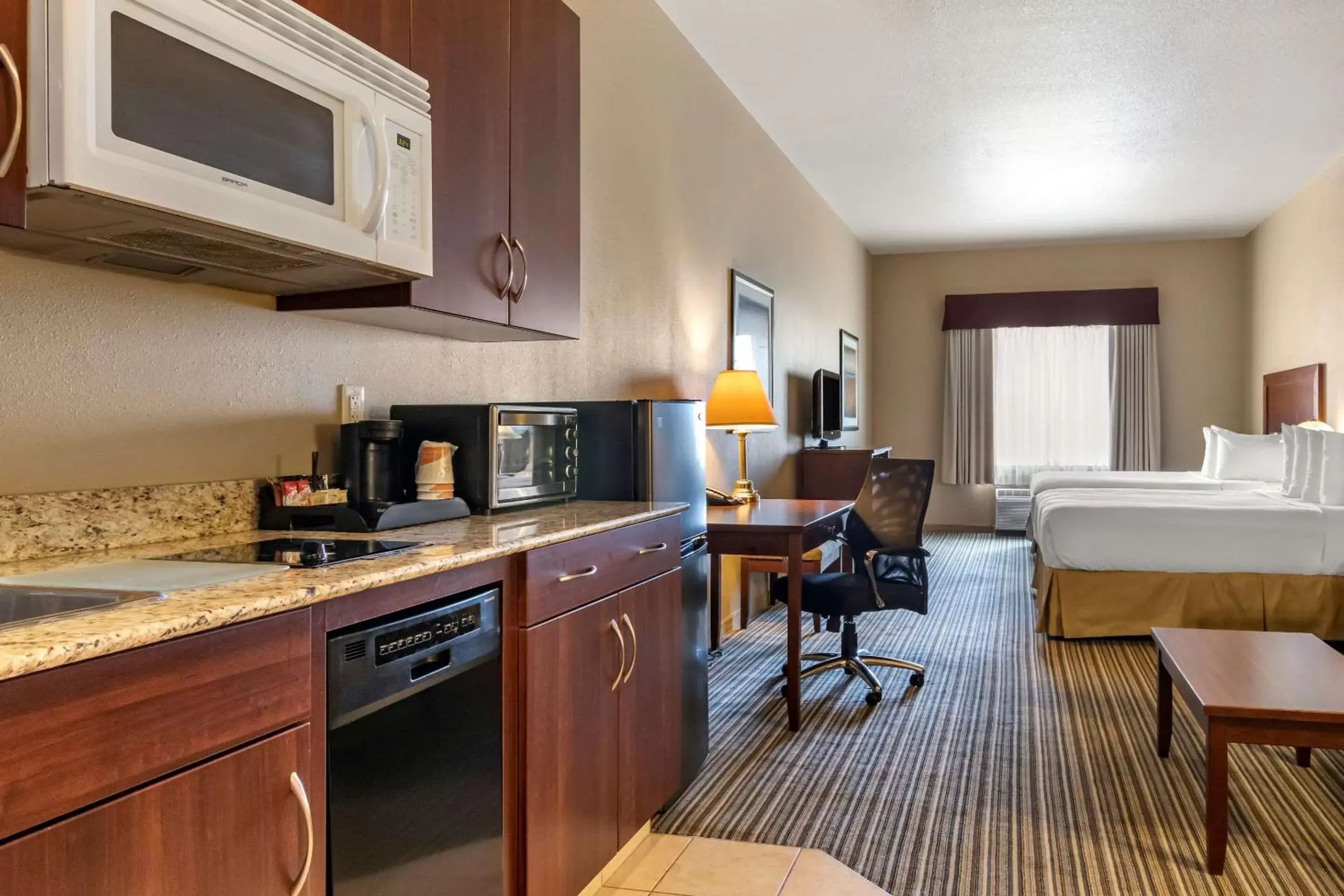 Photo of the whole room, Kitchen/Kitchenette in Quality Inn & Suites