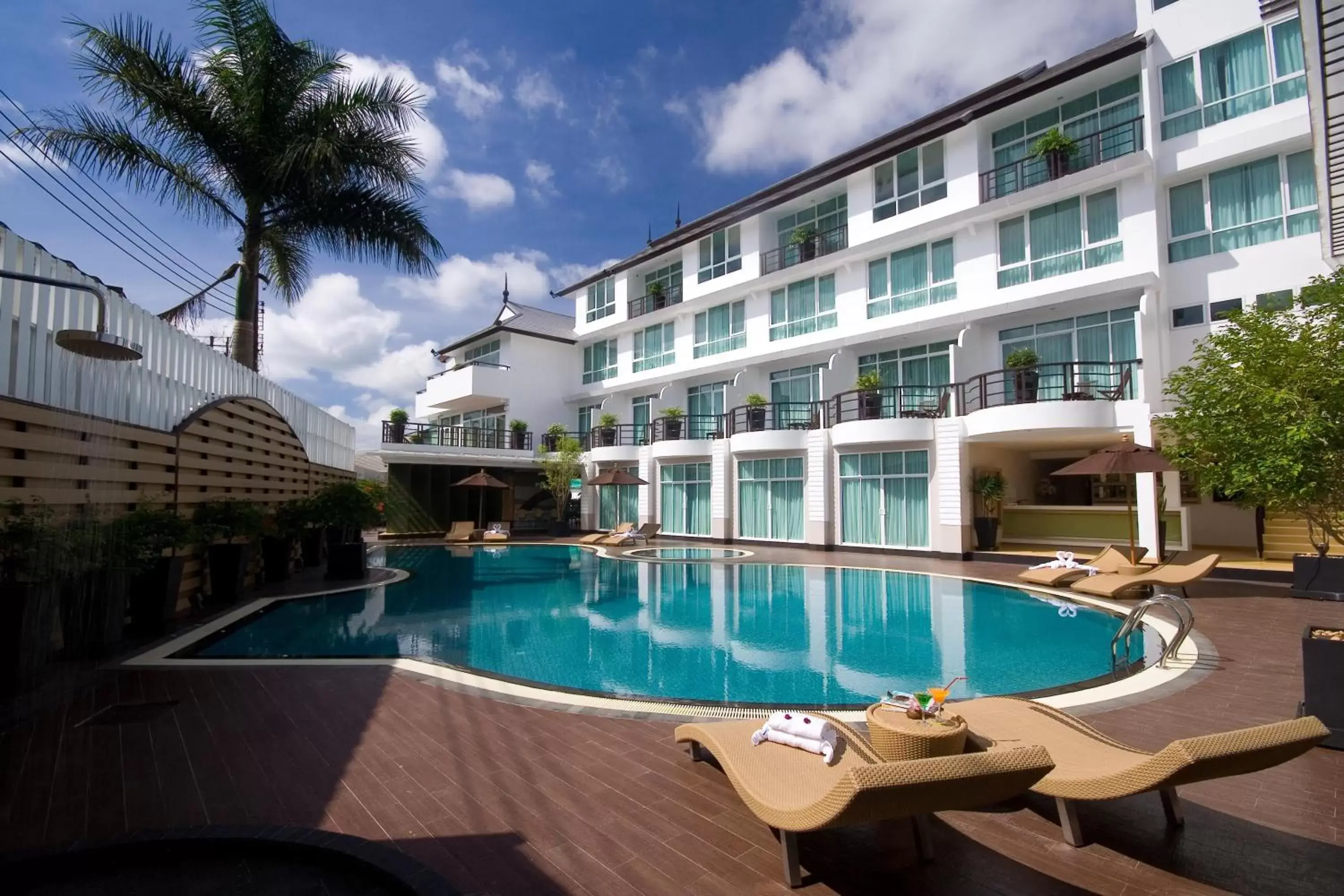 Swimming pool, Property Building in A-Te Chumphon Hotel - SHA Plus