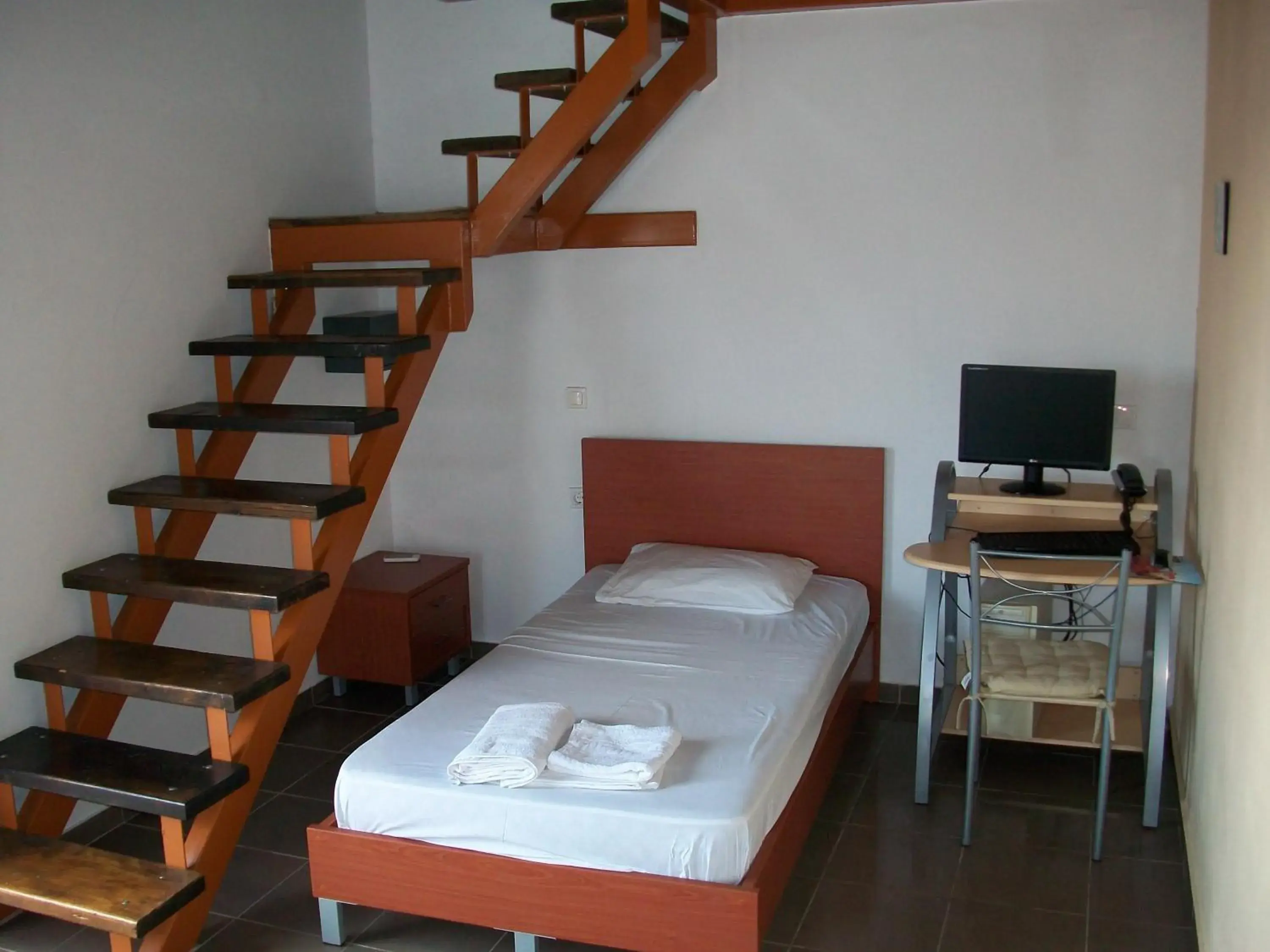 Living room, Bed in Elounda Sunrise Apartments