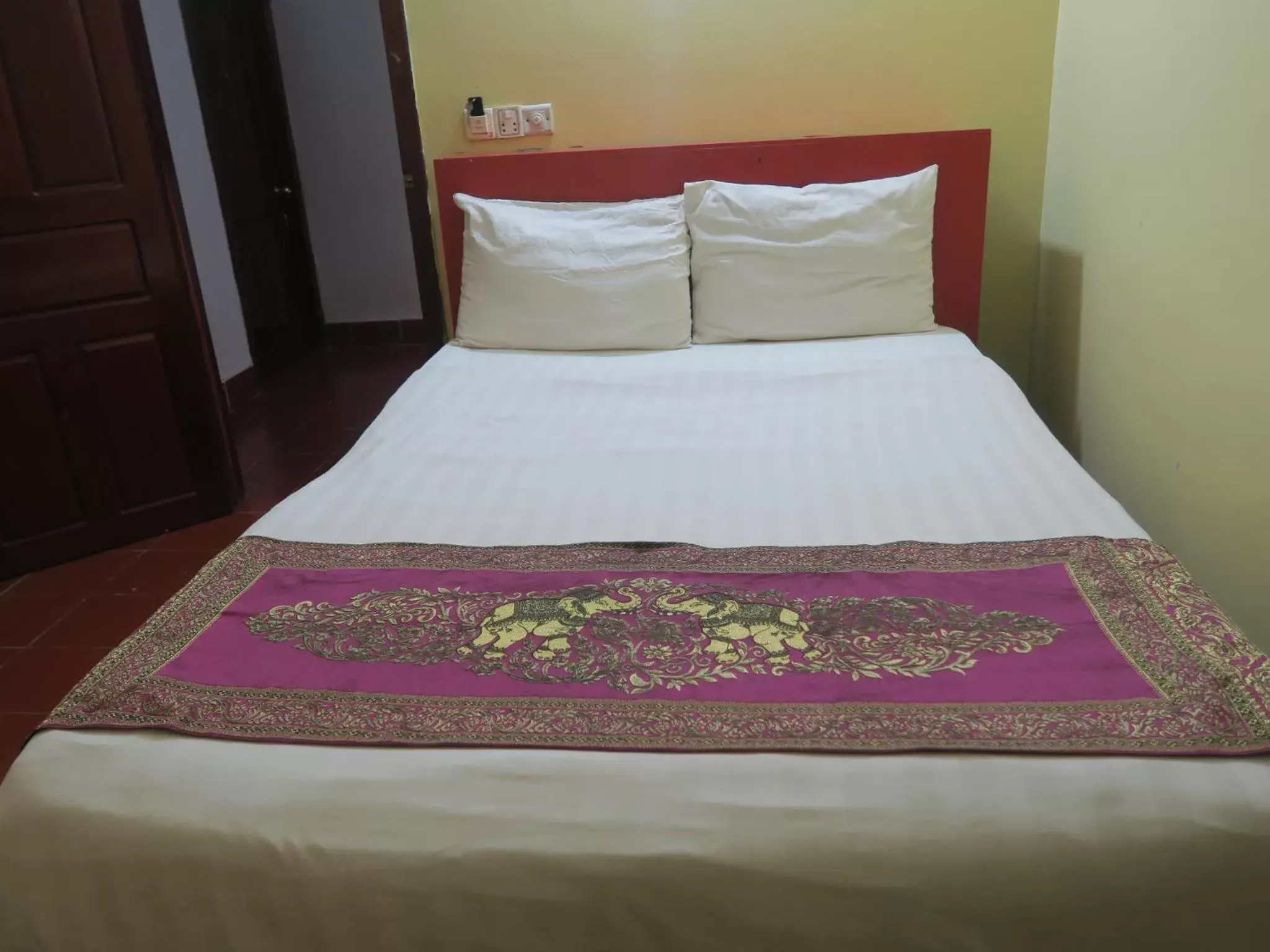 Bed in River Dolphin Hotel