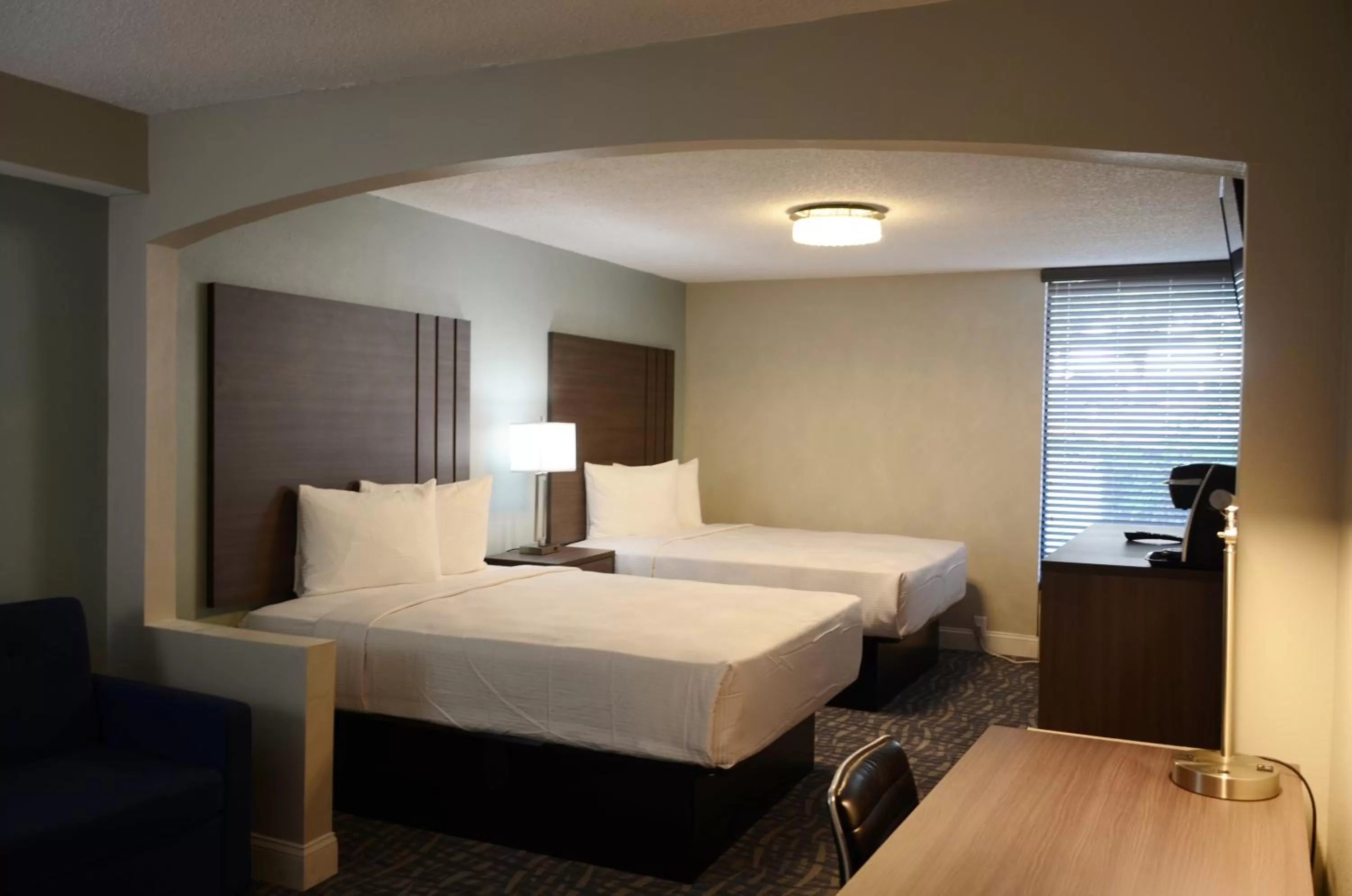 Bed in Opal Hotel & Suites