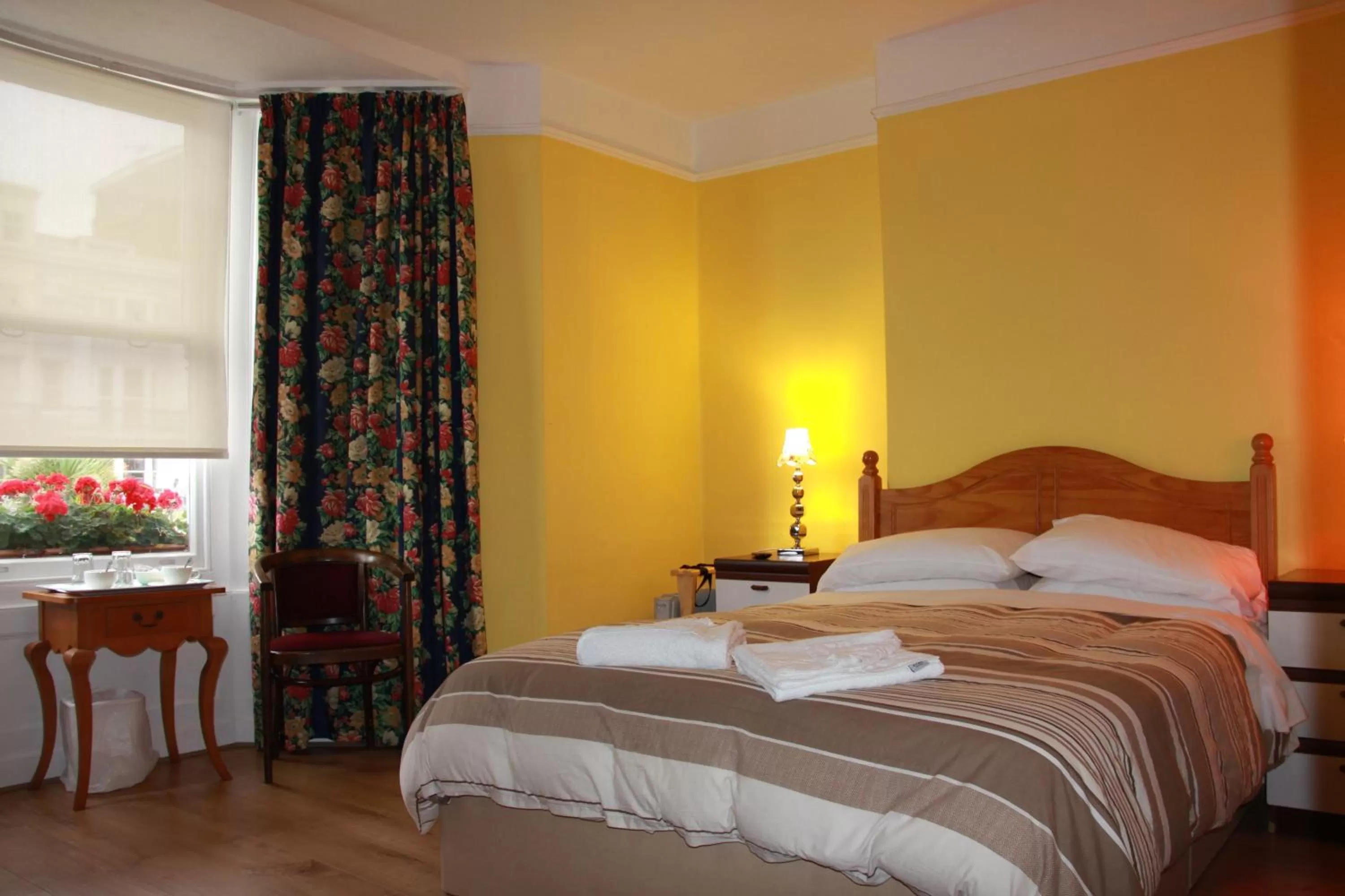 Bed in Ambassador Hotel