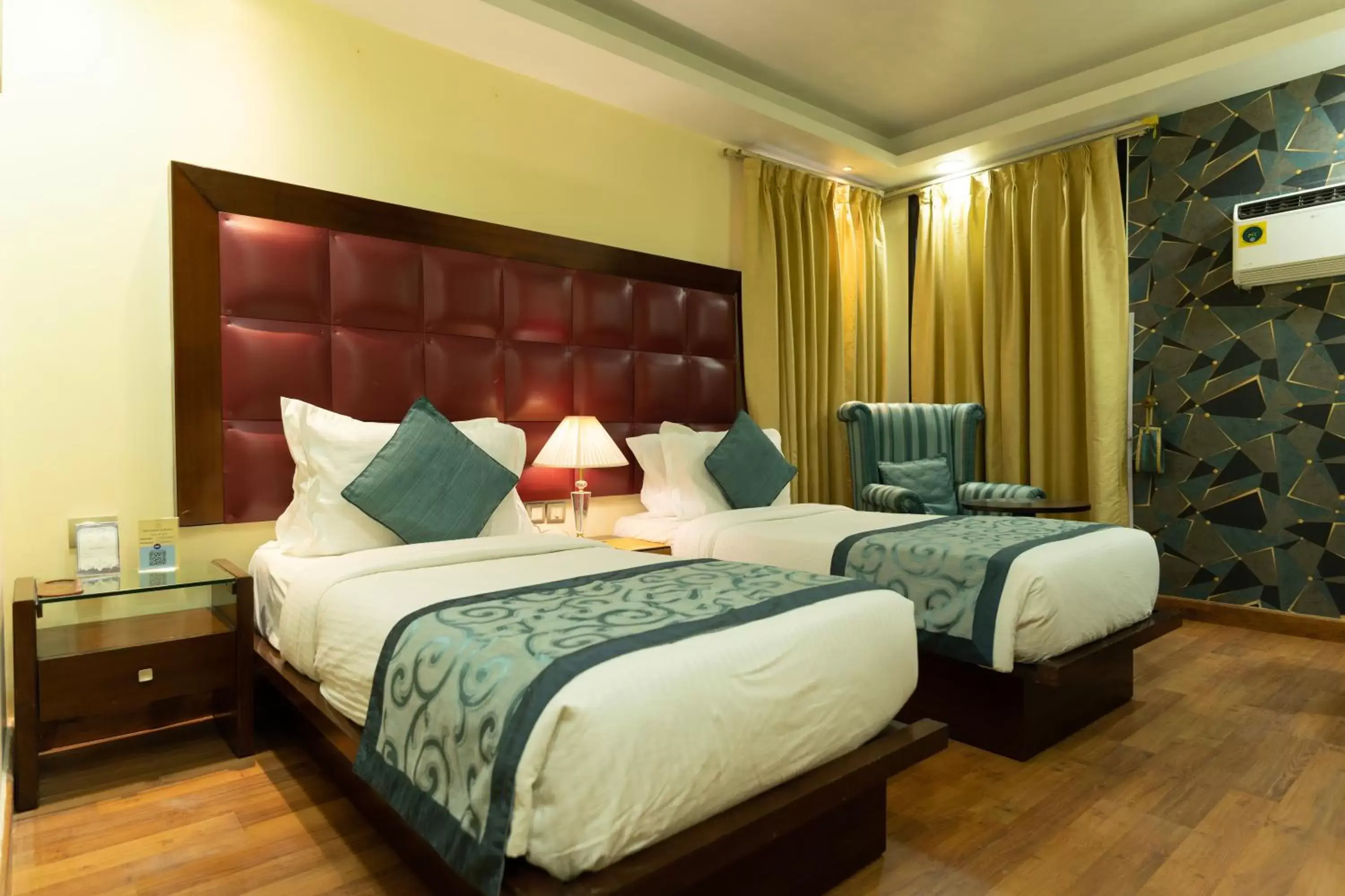 Bed in The Grand Orion - Kailash Colony