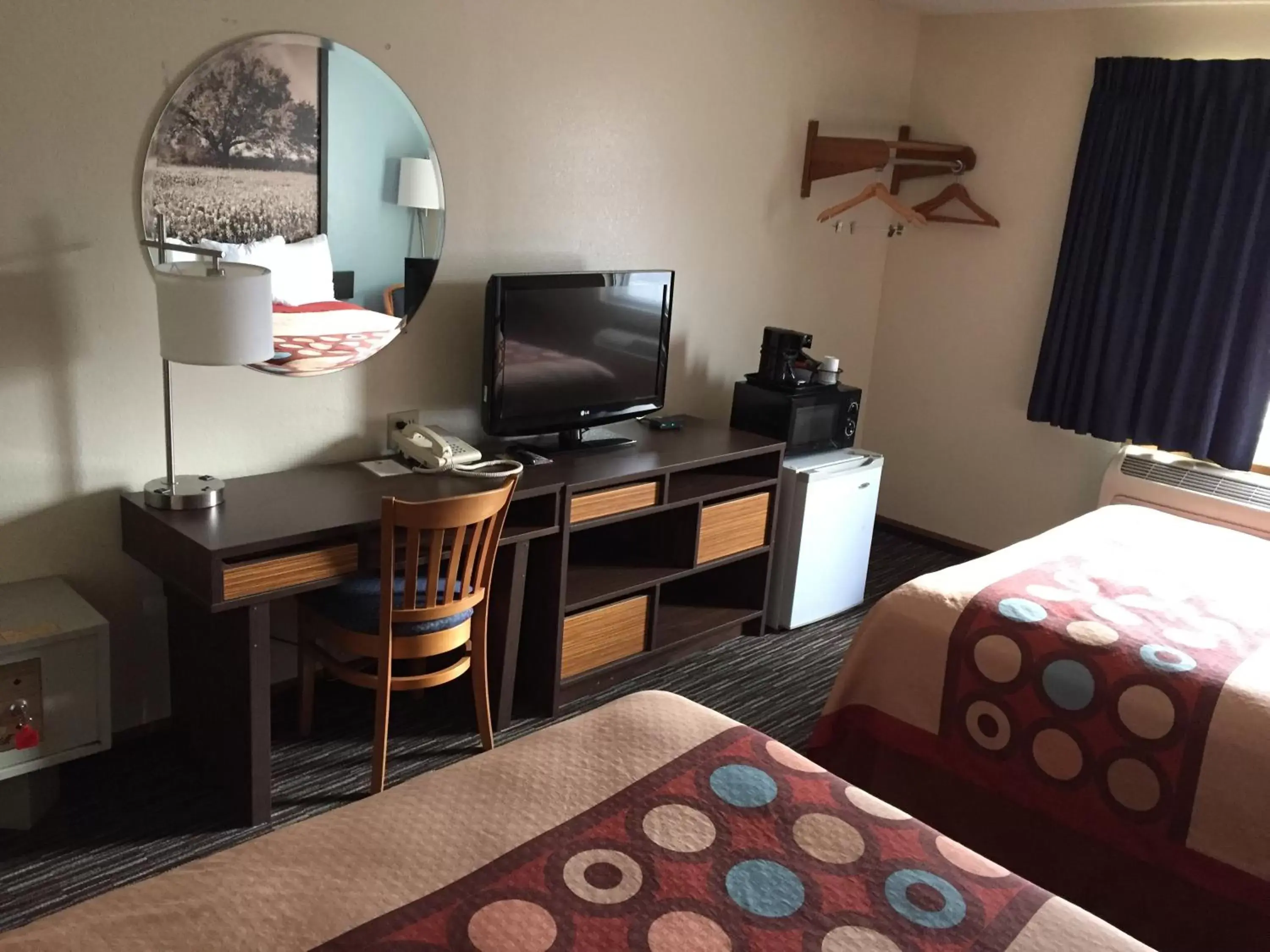 Photo of the whole room, TV/Entertainment Center in Super 8 by Wyndham College Station