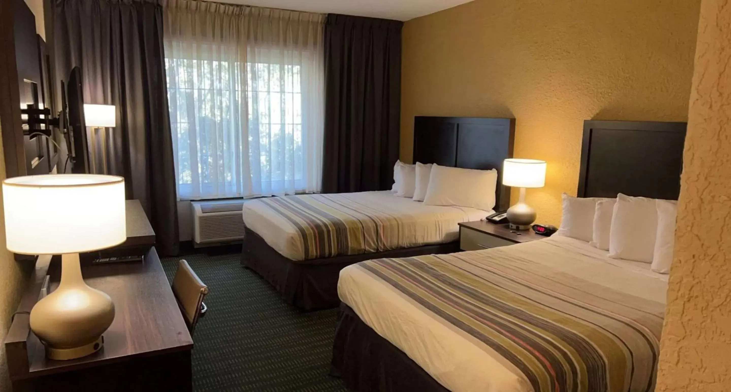 Bedroom, Bed in SureStay Plus Hotel by Best Western Vero Beach