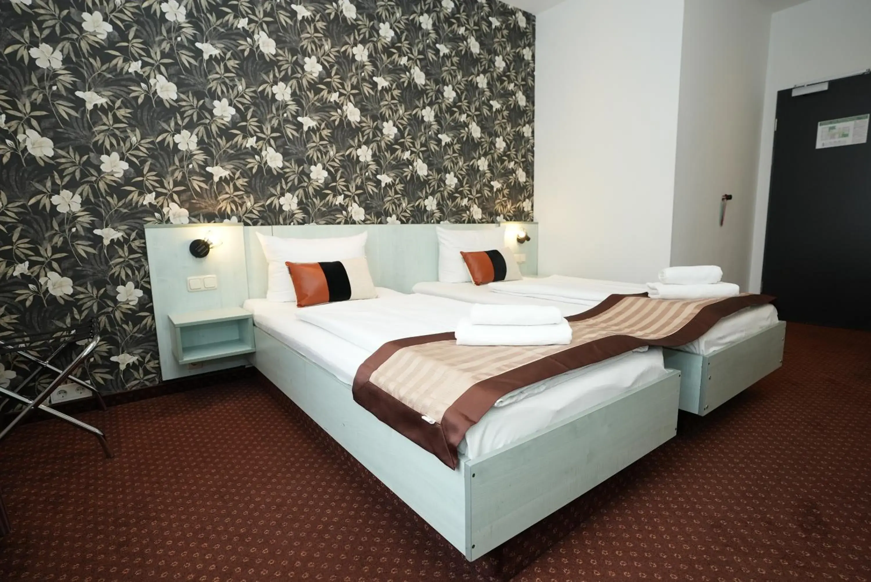 Bed in Hotel Attaché an der Messe