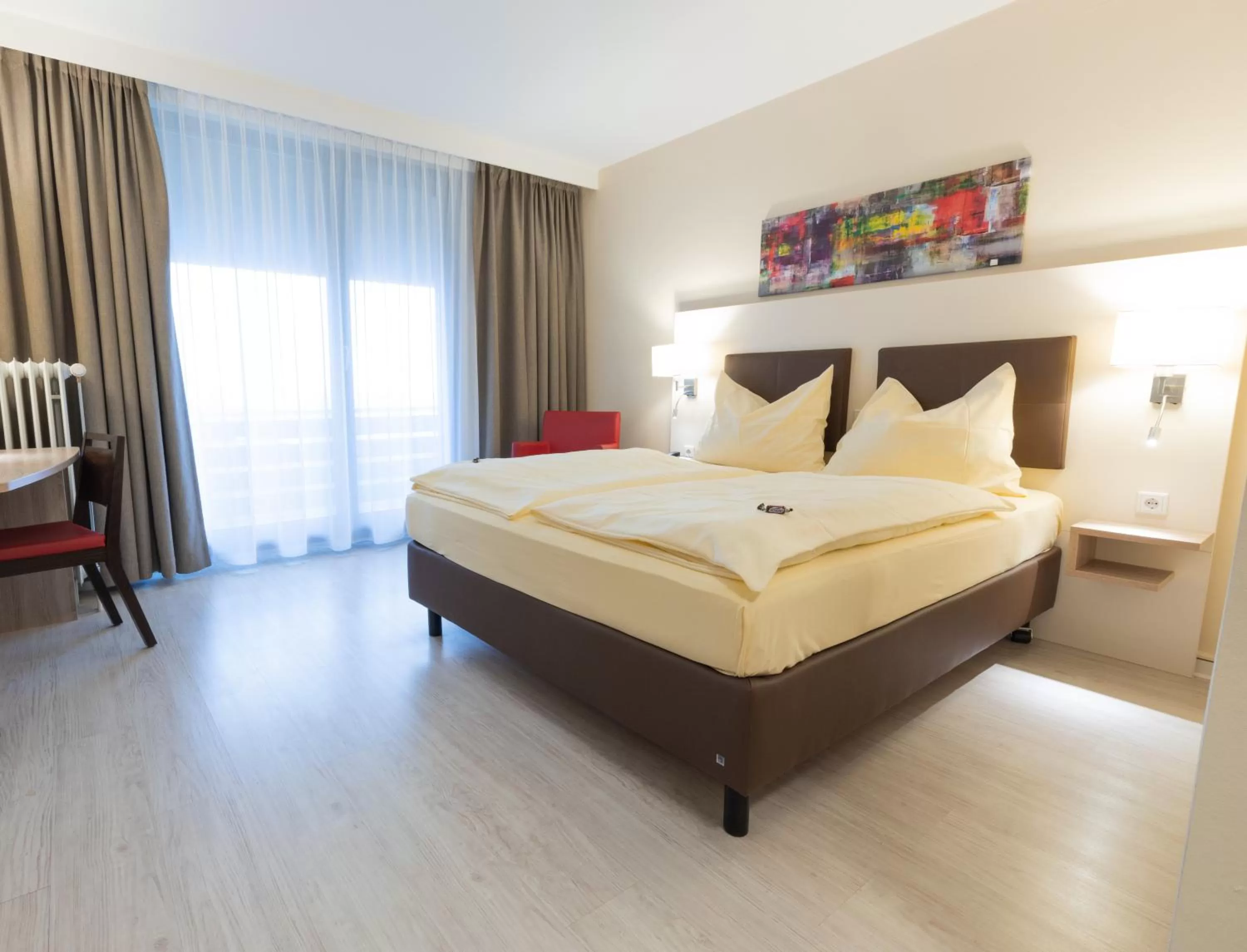 Photo of the whole room, Bed in Montana Landhotel Gummersbach-Nord