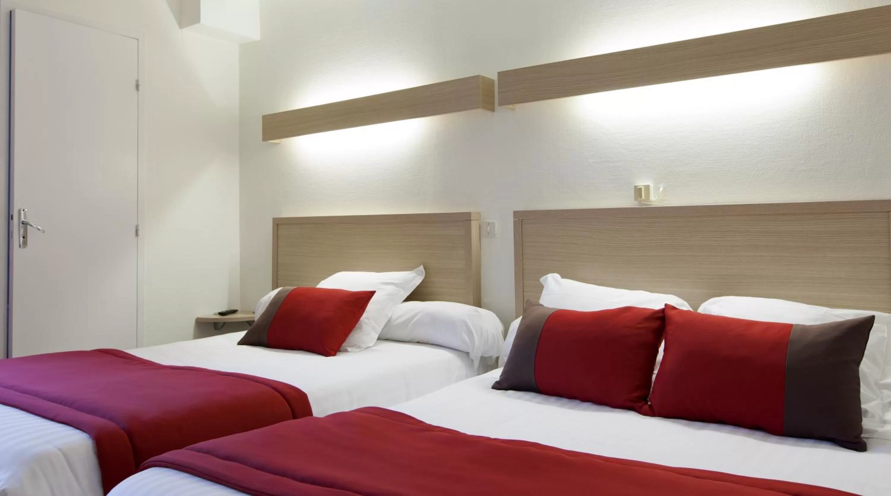 Bed in Logis Hotel Chateaubriand