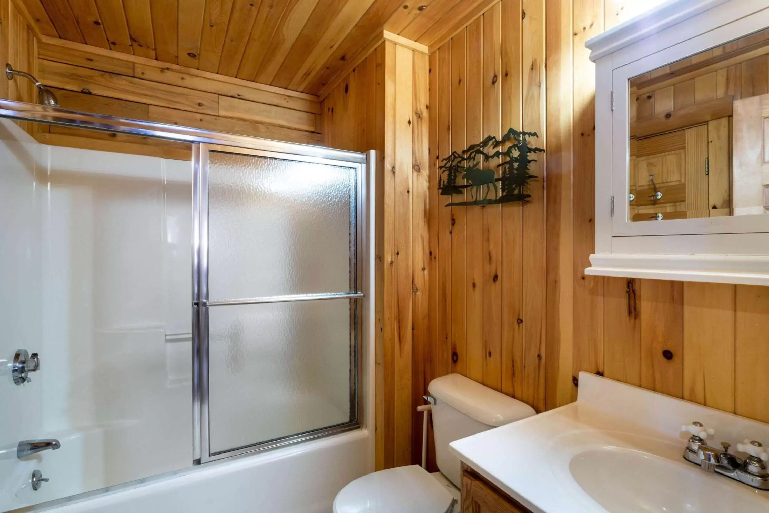 Bed, Bathroom in Rangeley Lake Resort a Ramada by Wyndham