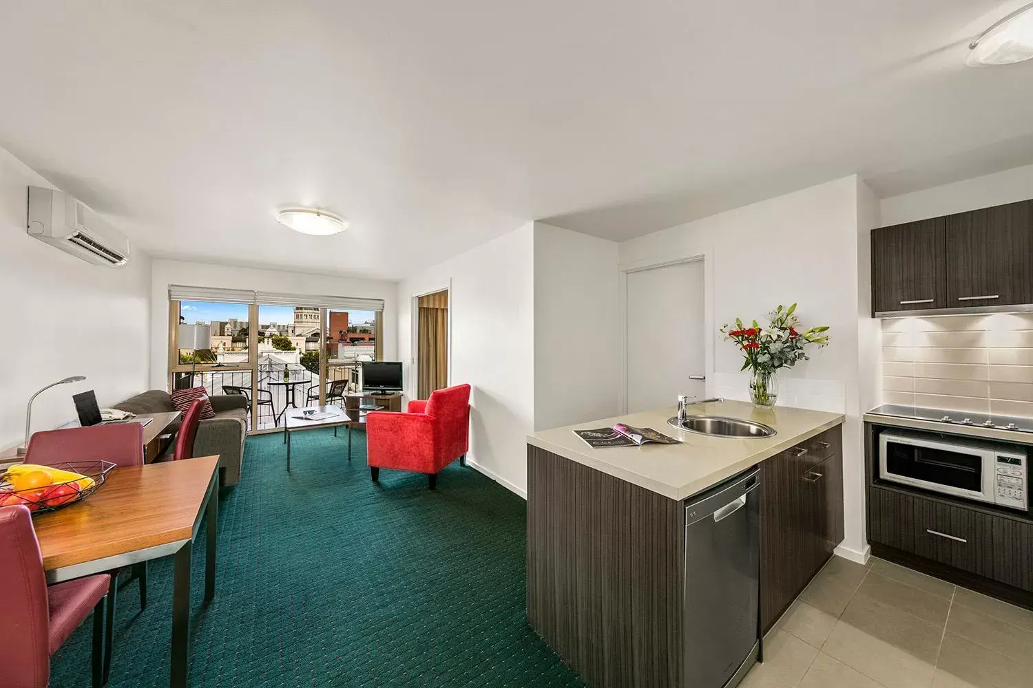 Living room, Kitchen/Kitchenette in Melbourne Carlton Central Apartment Hotel