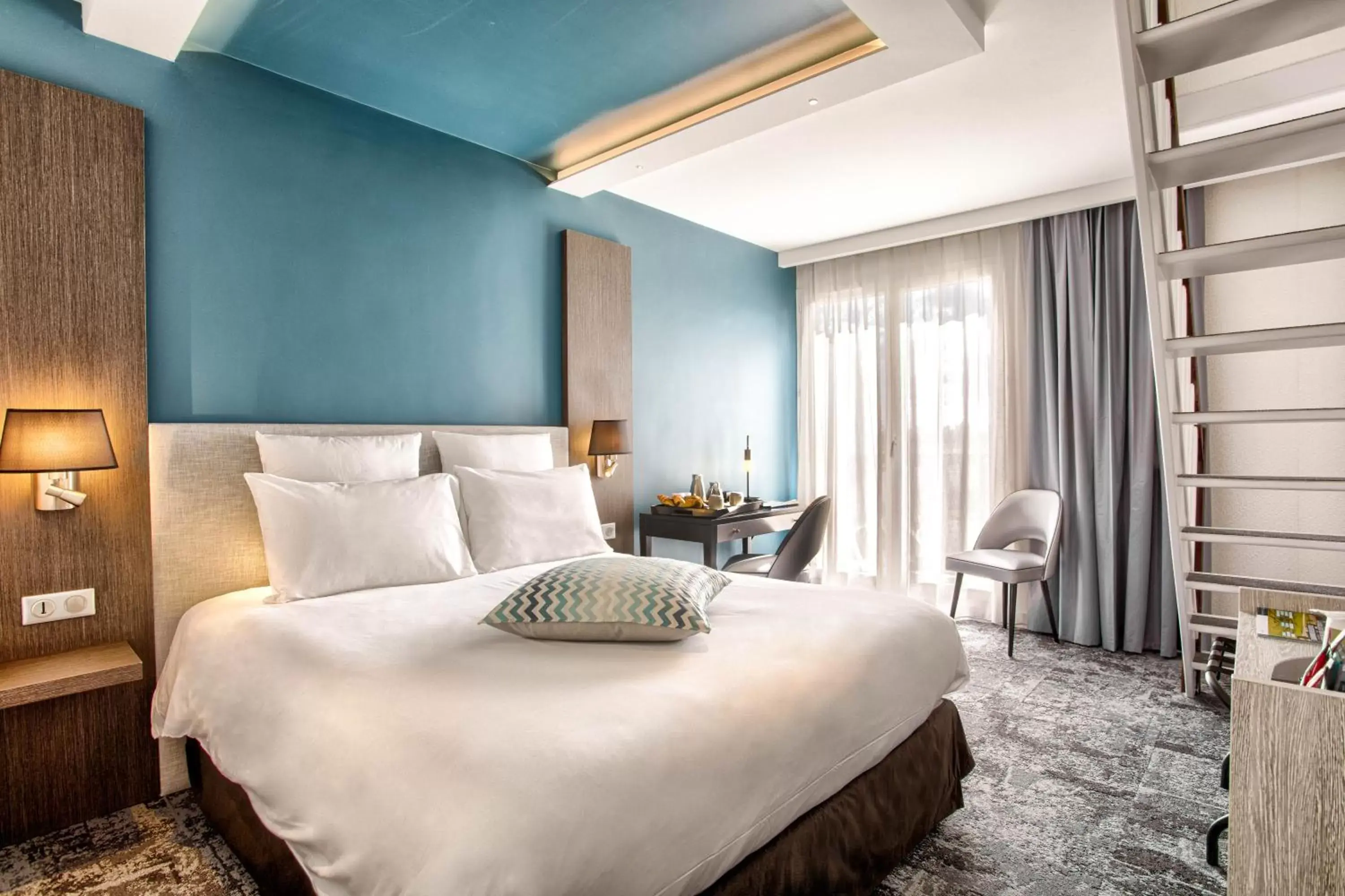 Duplex Superior Room with One Double Bed and Three Single Beds with Spa Access in Mercure Cabourg Hôtel & Spa Duplex Superior Room with One Double Bed and Three Single Beds with Spa Access in Mercure Cabourg Hôtel & Spa
