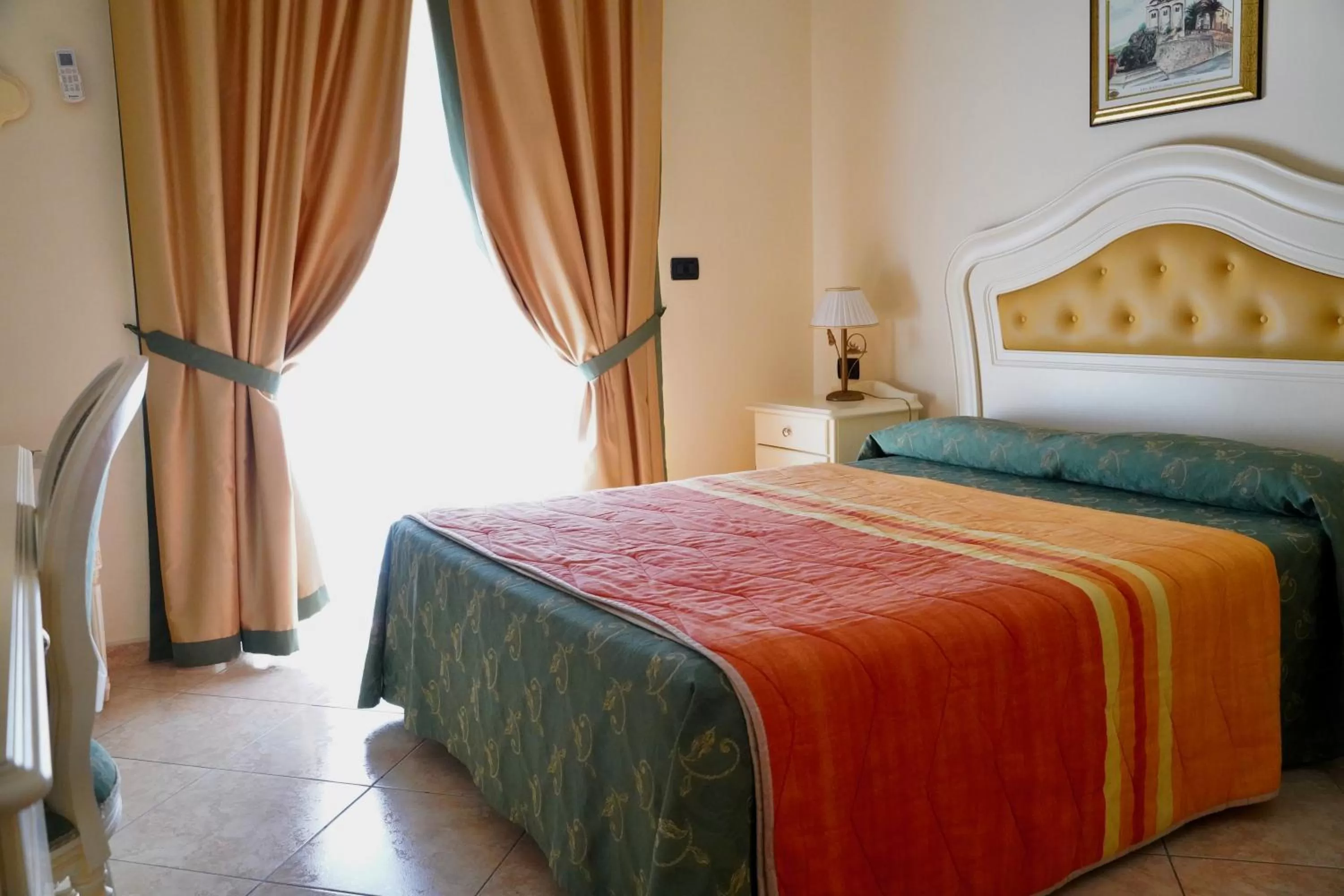 Bedroom in Hotel Roscianum Welness SPA