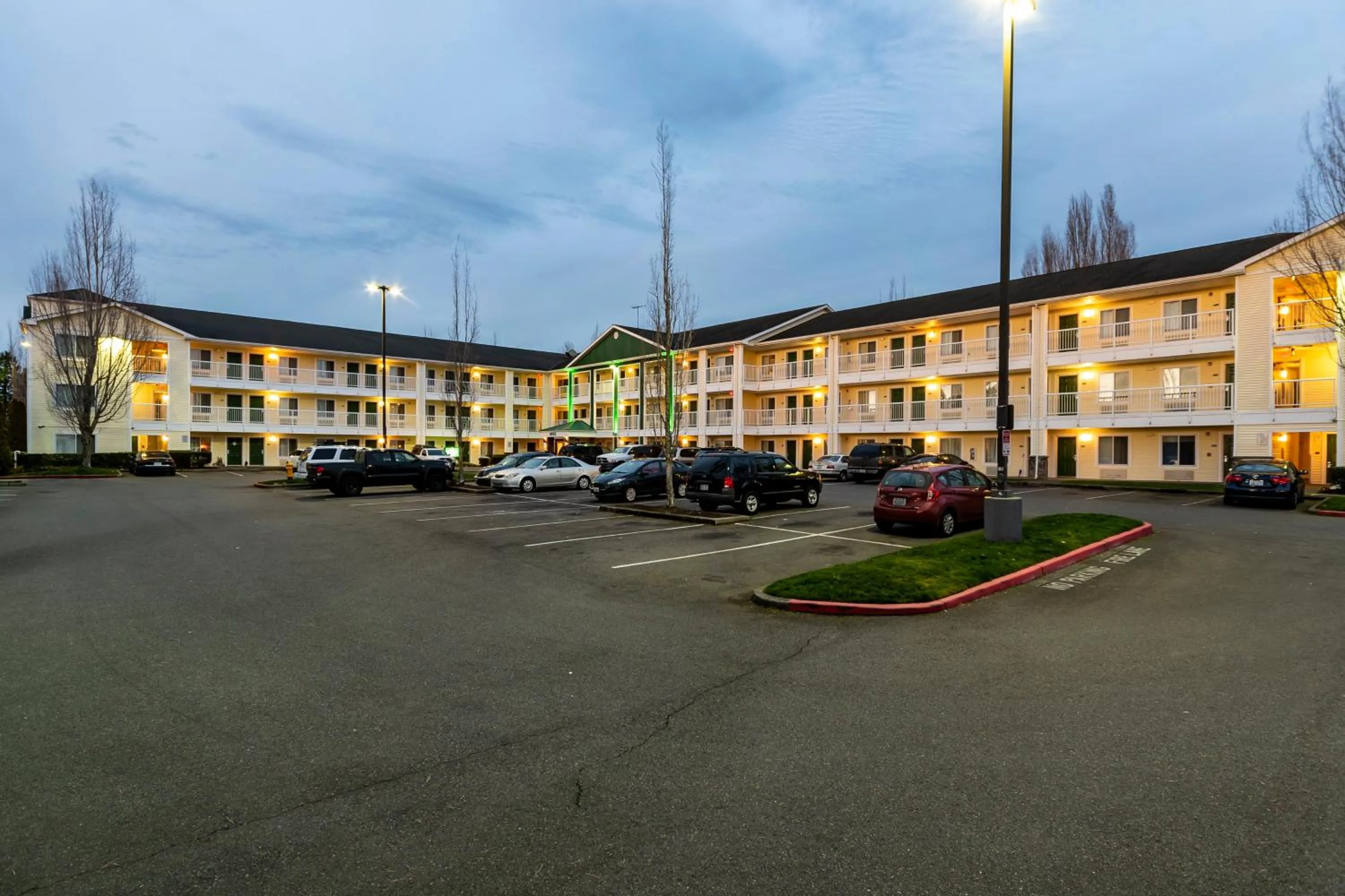 Property building in HomeTowne Studios by Red Roof Seattle - Kent/Des Moines