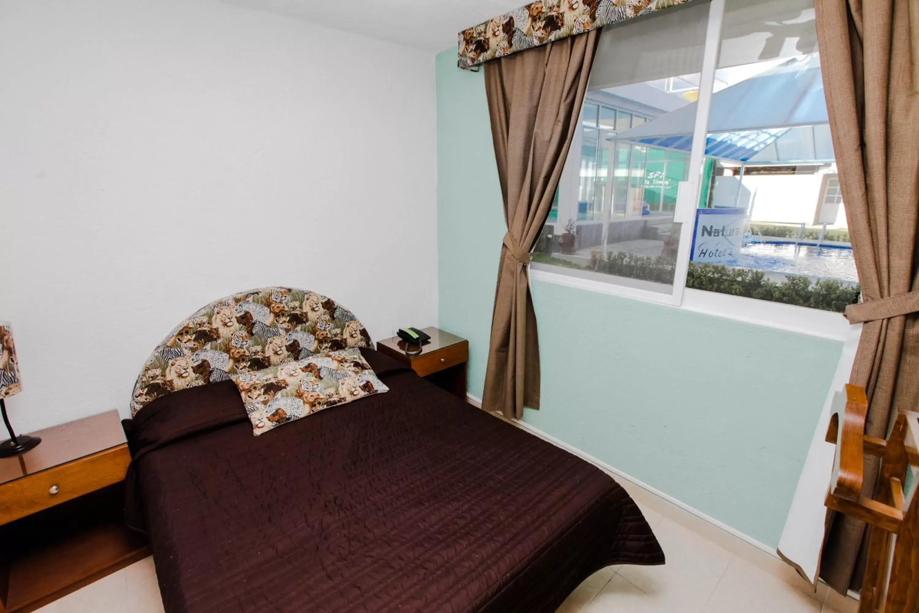 Bedroom, Bed in Natural Suites Hotel- cerca de Africam Safari Valsequillo Puebla