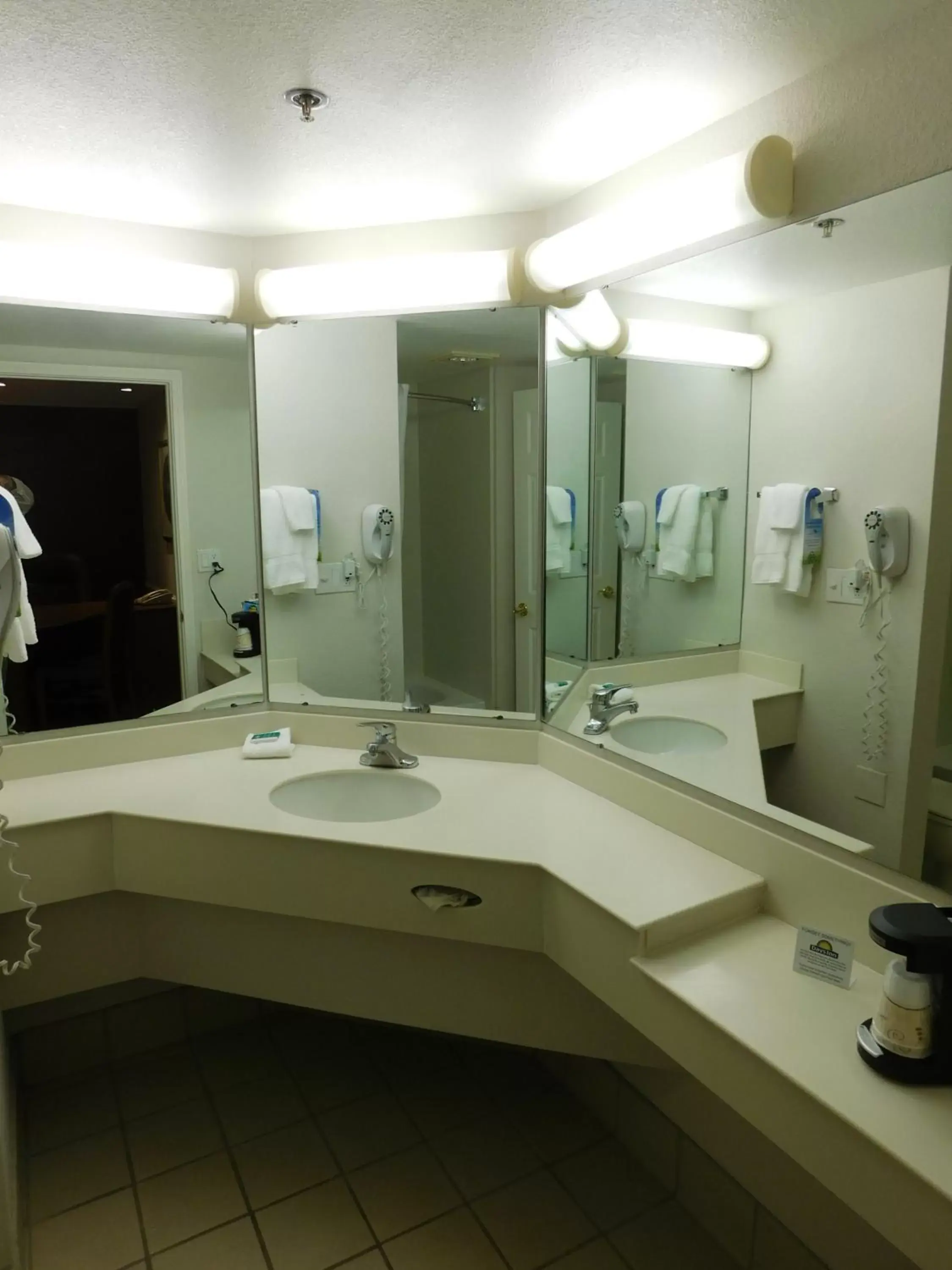 Bathroom in Days Inn & Suites by Wyndham Arlington Heights