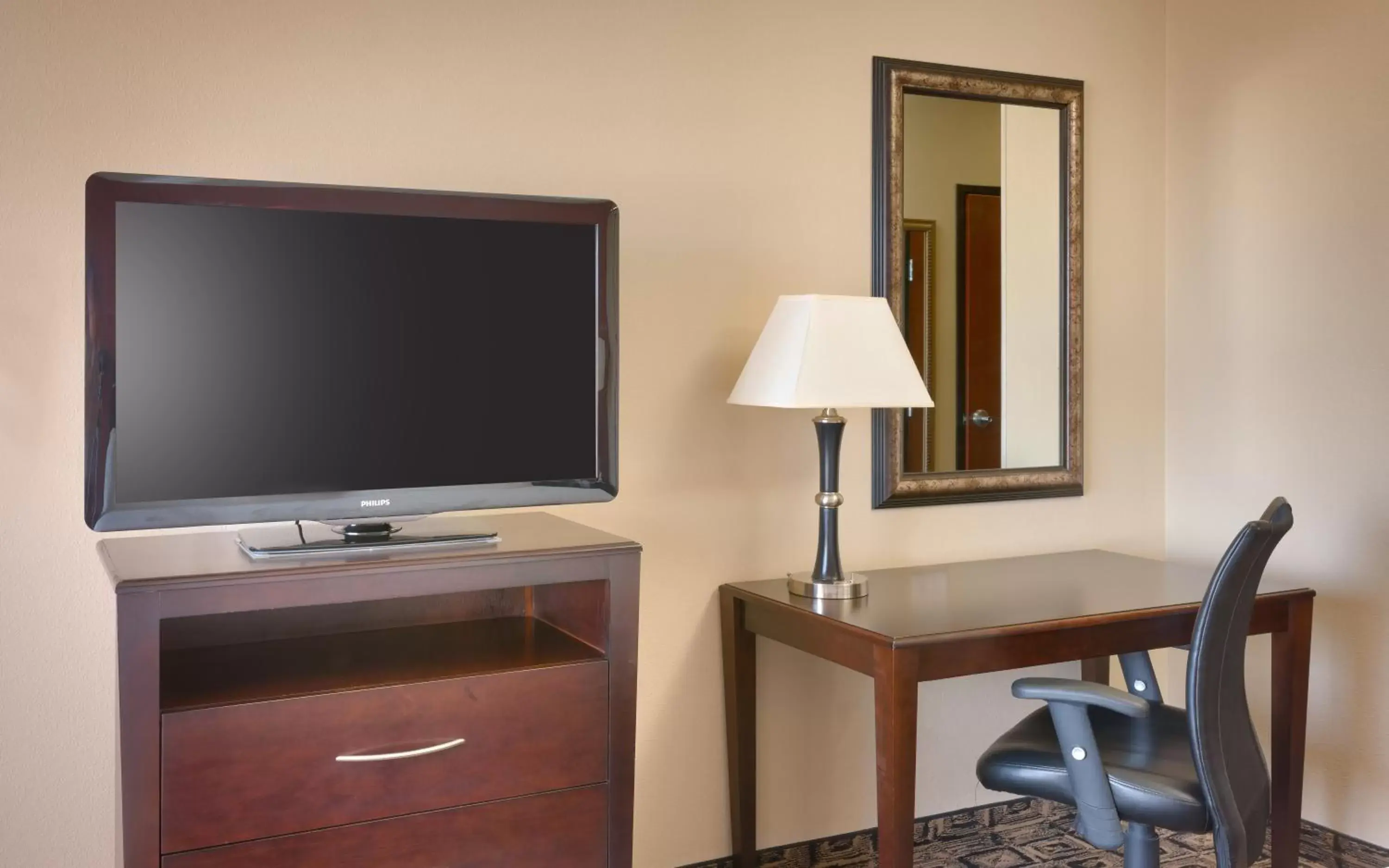 Photo of the whole room, TV/Entertainment Center in Holiday Inn & Suites Salt Lake City - Airport West, an IHG Hotel