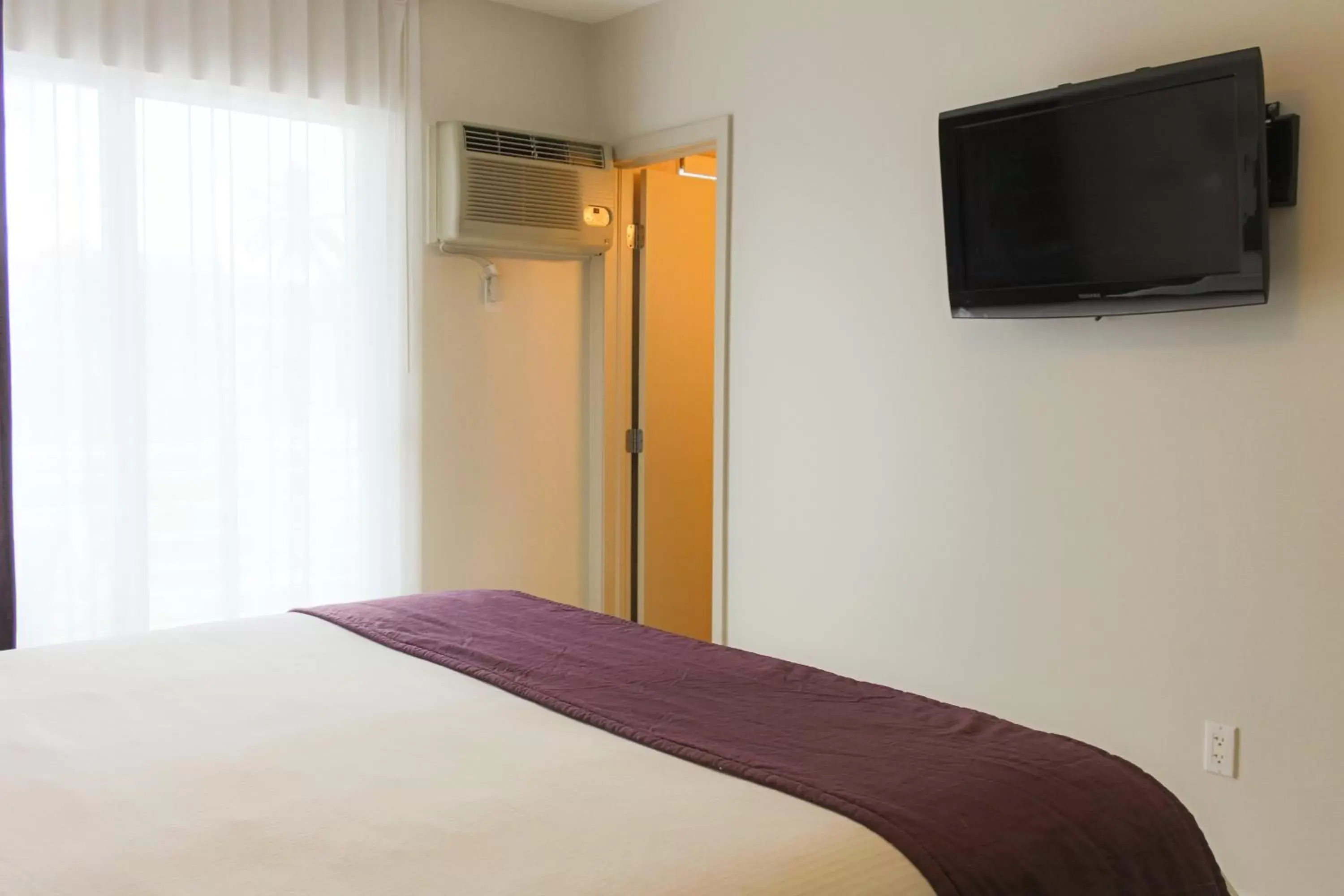 Bed in Collins Hotel Bed in Collins Hotel