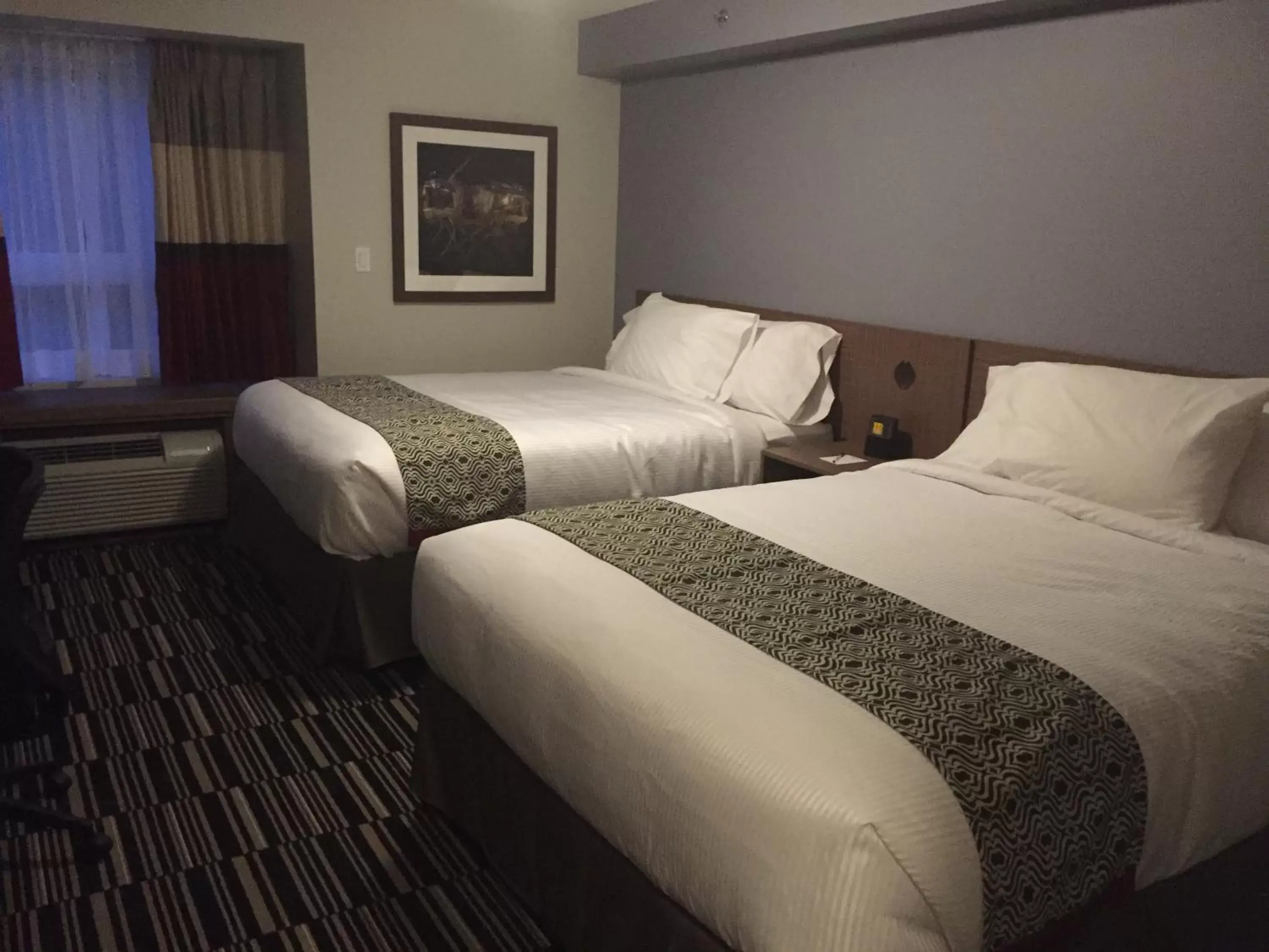 Bed in Microtel Inn & Suites by Wyndham Kirkland Lake