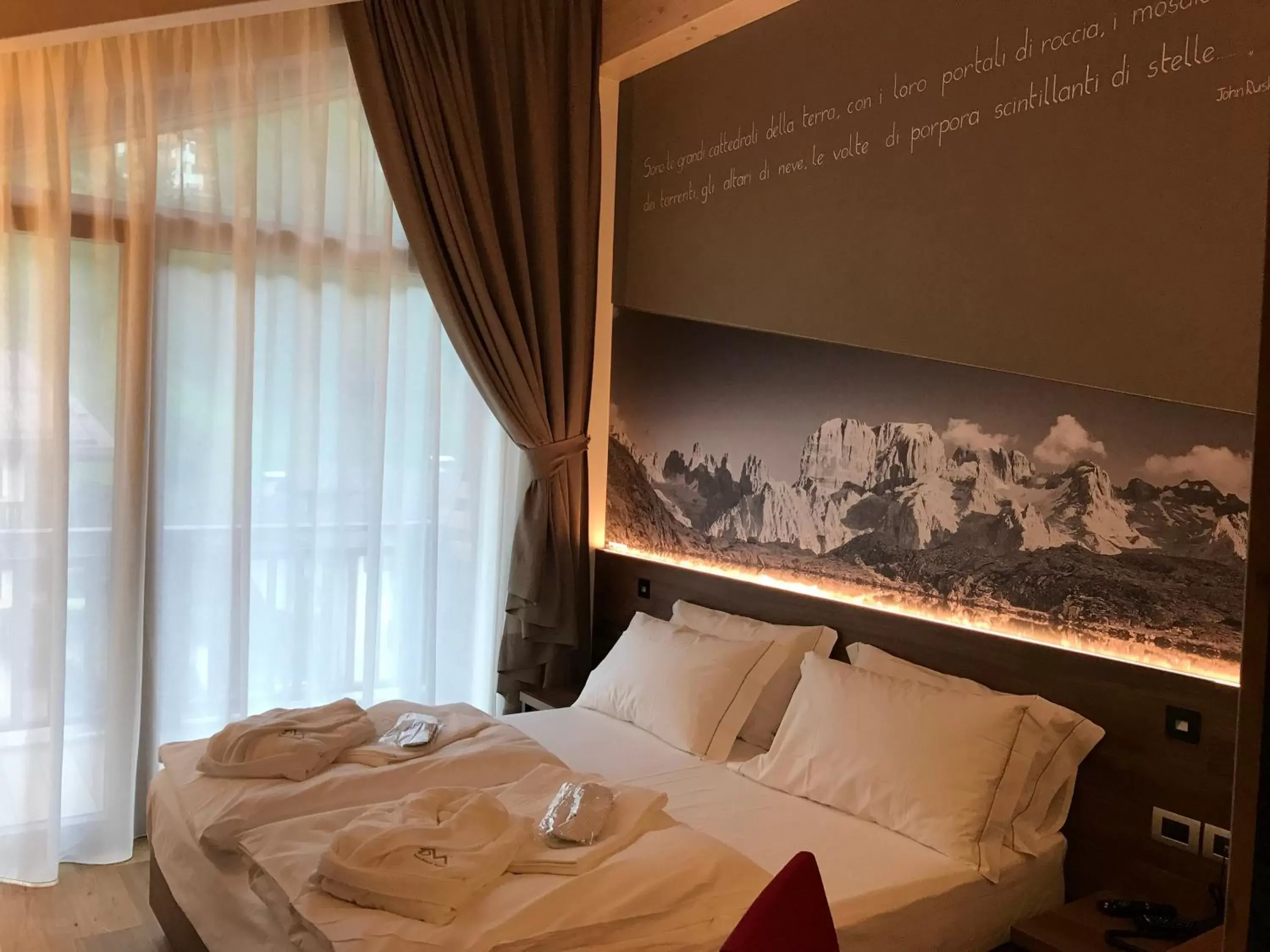 Decorative detail, Bed in Dolomeet Boutique Hotel