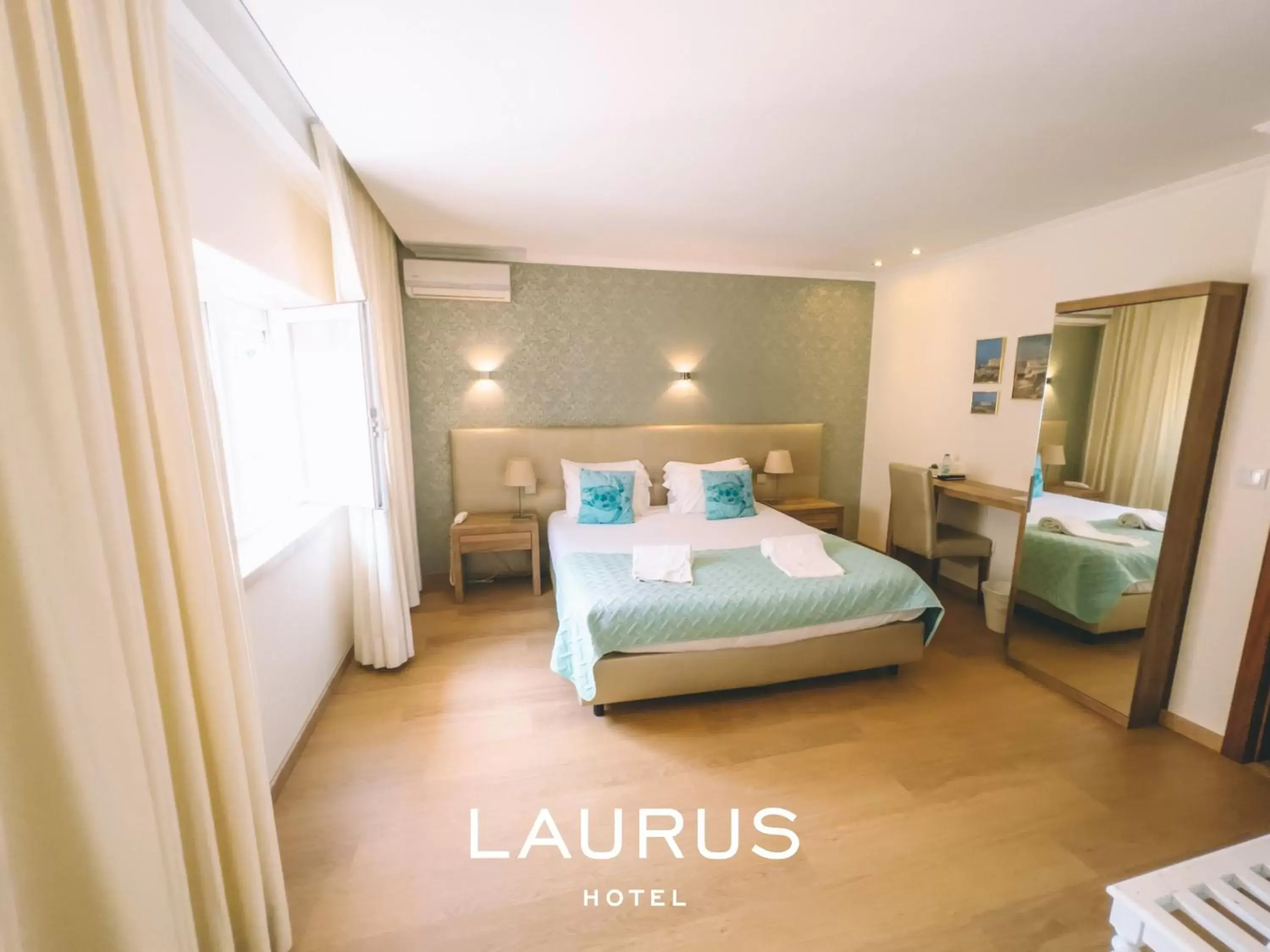 Bed in Laurus Hotel