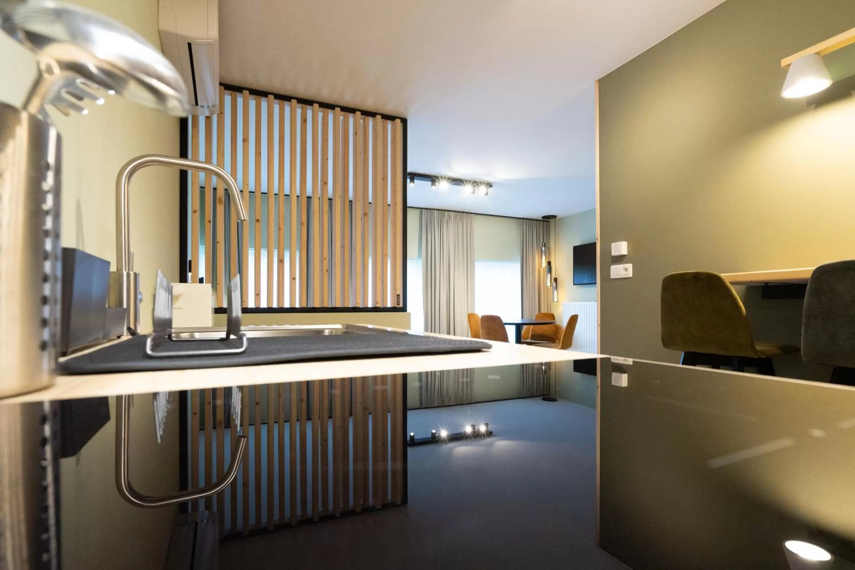 Kitchen or kitchenette in Appart hôtel En Ville