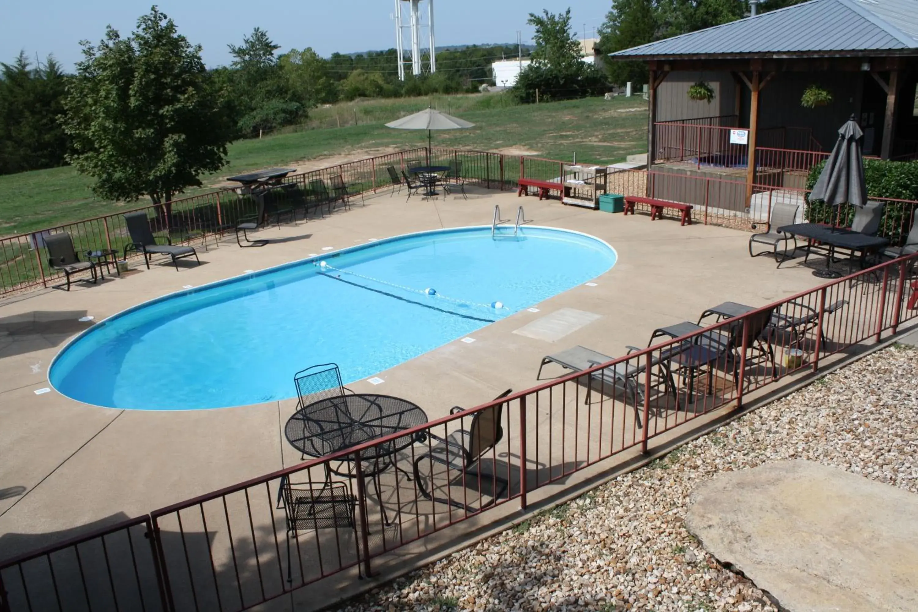 Patio, Swimming Pool in Outback Roadhouse Motel & Suites Branson