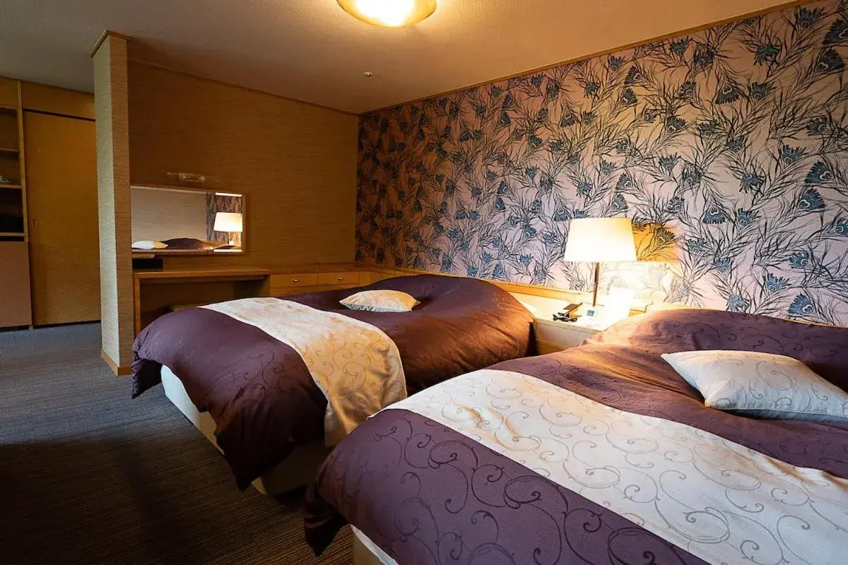 Bed in Hotel Kanronomori