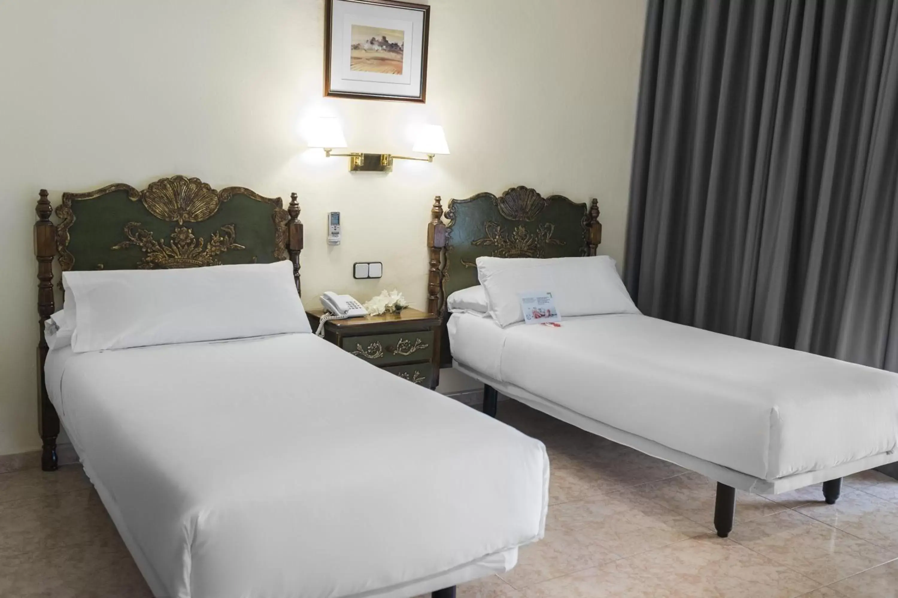 Bedroom in Mesón Castilla Atiram Hotels