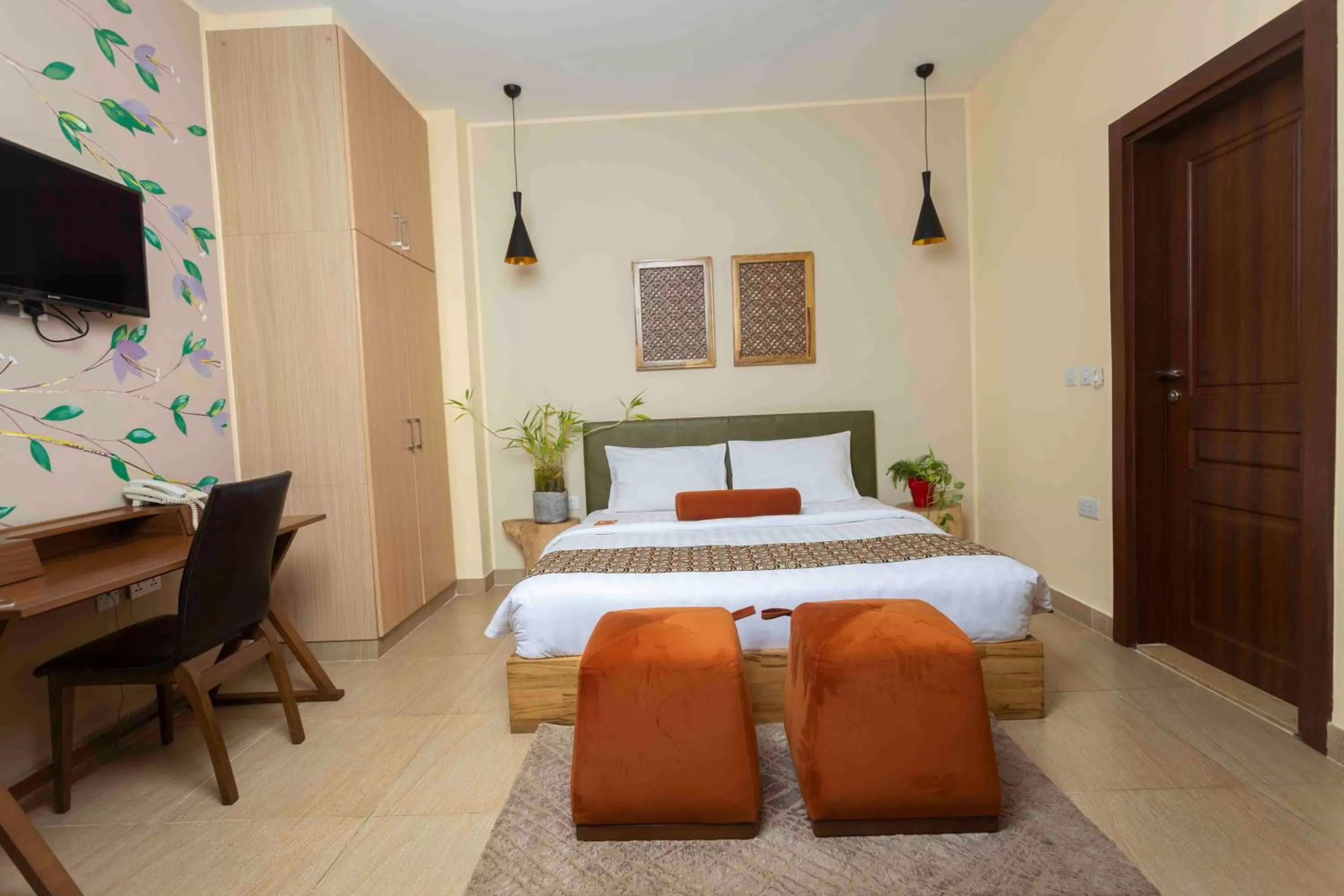 Bed in Roots Hotel Apartment