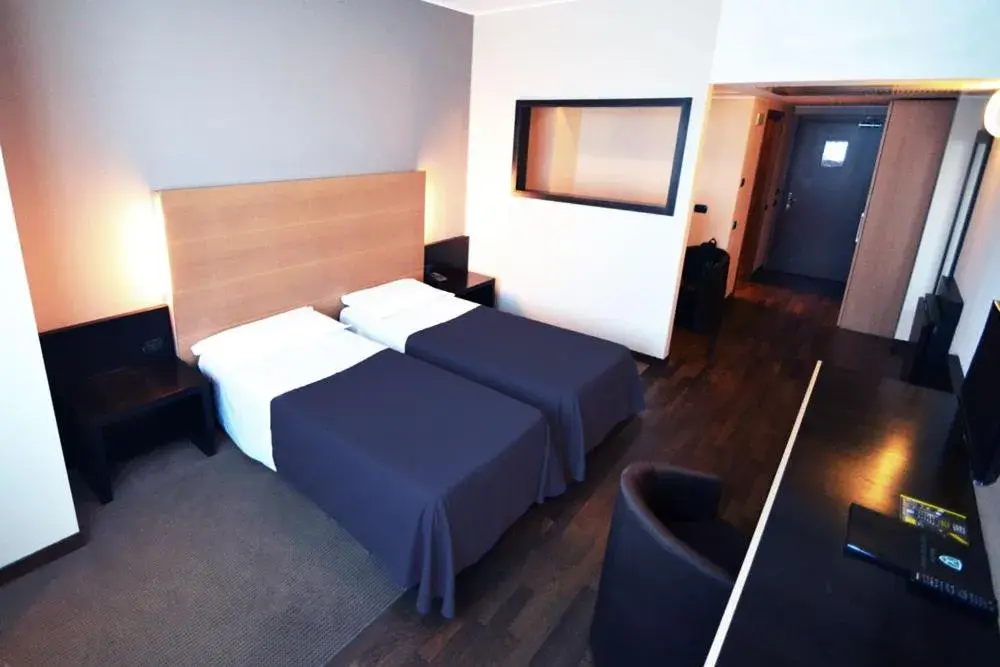 Bed in Golf Hotel Milano
