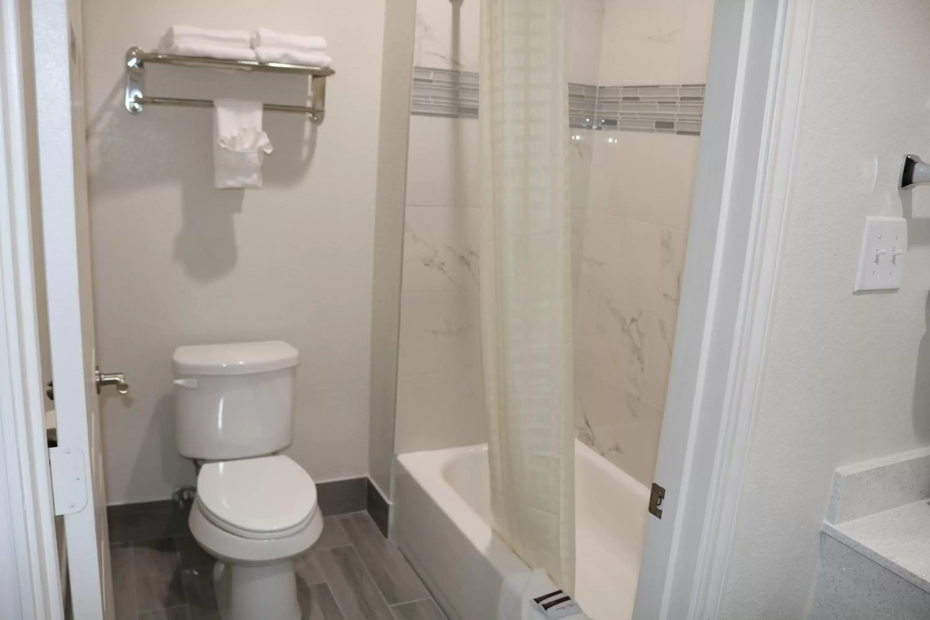 Bathroom in Scottish Inn & Suites - IAH Airport