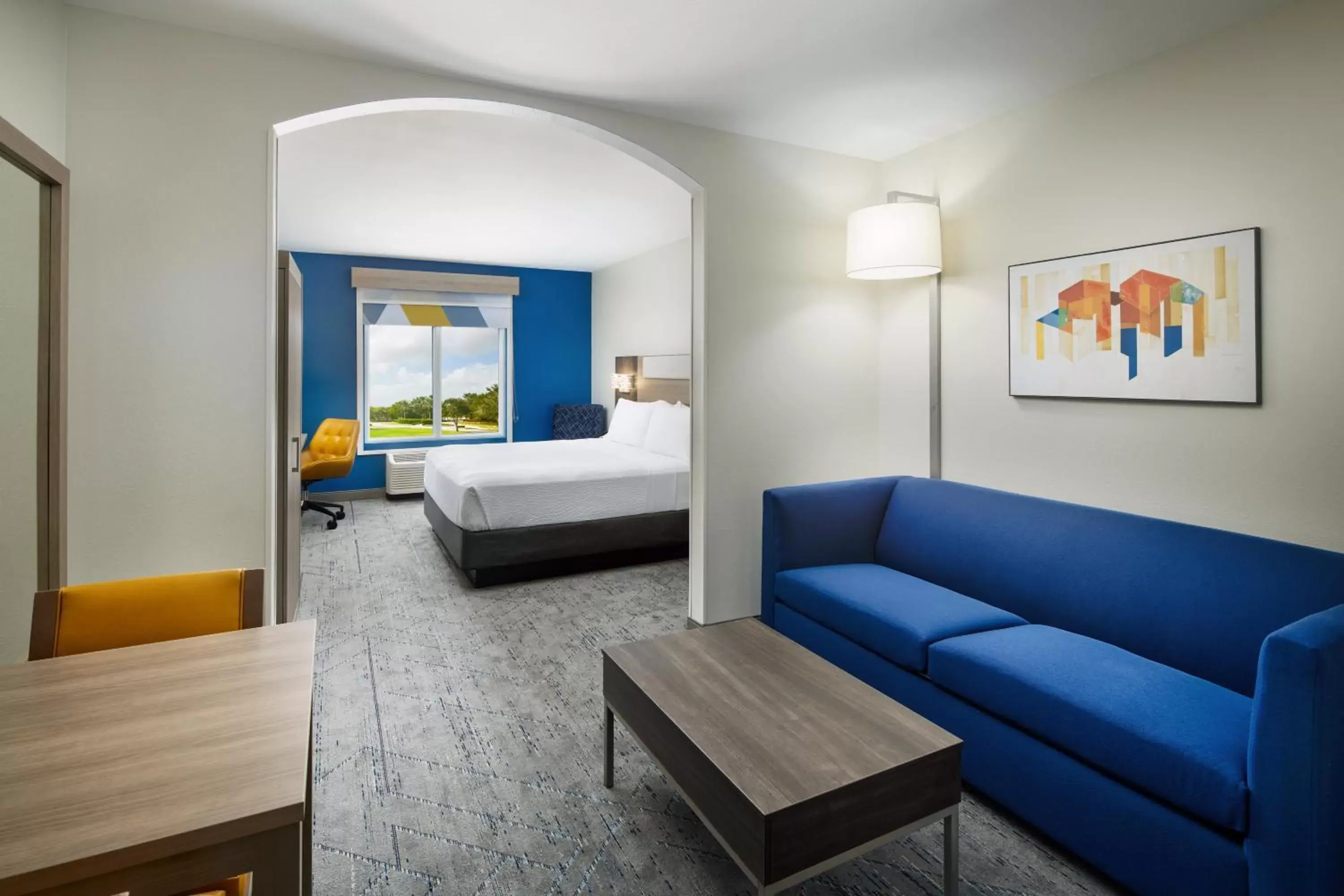 Bed, Seating Area in Holiday Inn Express Hotel & Suites Port St. Lucie West, an IHG Hotel